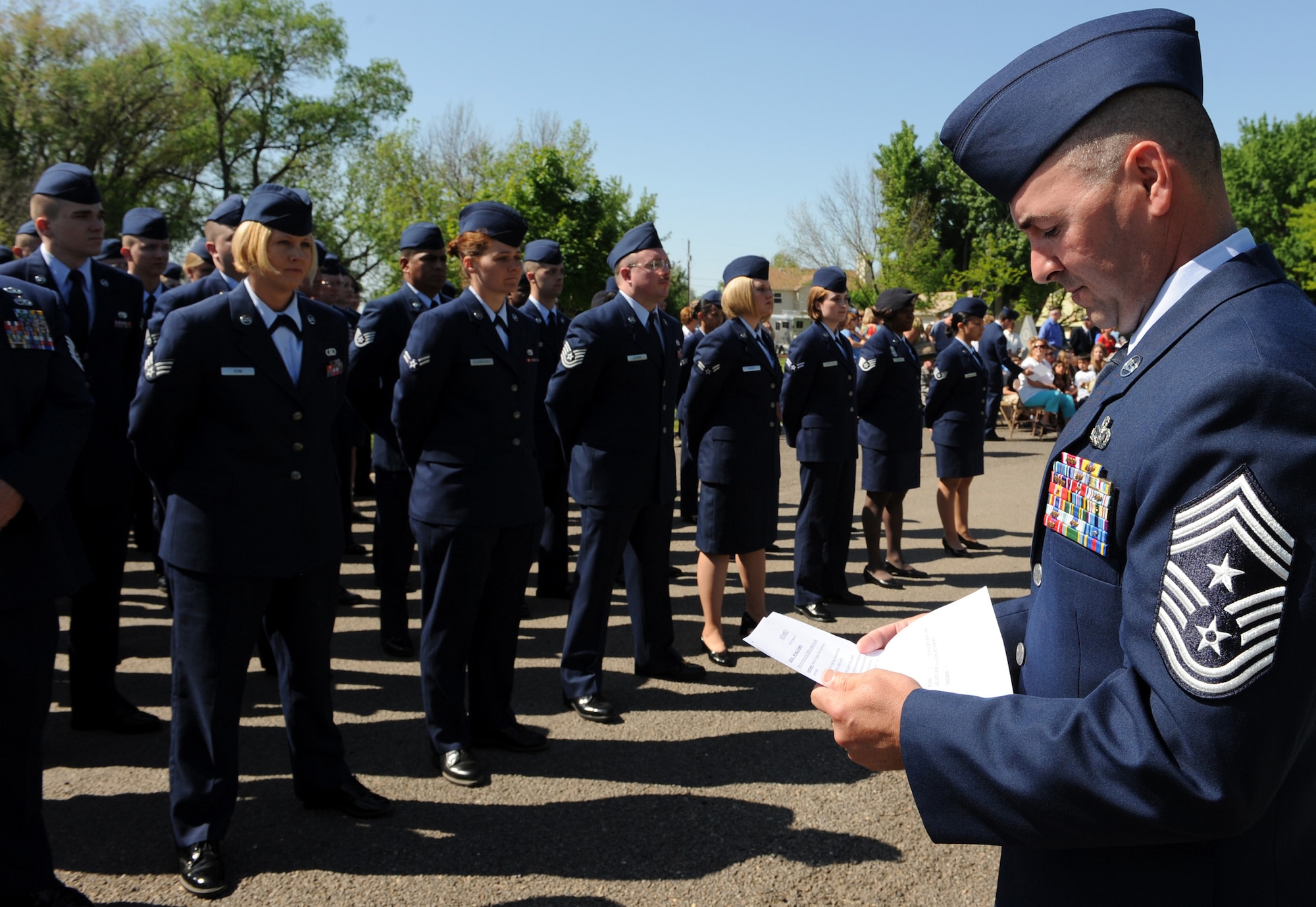 MOUNTAIN HOME AIR FORCE BASE, Idaho - Chief Master Sgt. Ronald McCarthy, 366th Fighter Wing command chief, reviews the program for the Memorial Day Ceremony held at Mountain View Cemetery in Mountain Home May 25. Gunfighters and citizens of Mountain Home came together to pay respect to fallen veterans. Memorial Day was originally known as Decoration Day because it was time set aside to pay respect to the Civil War dead by strewing flowers or "decorations" on the graves of fallen comrades. (U.S. Air Force photo by Airman 1st Class Debbie Lockhart)