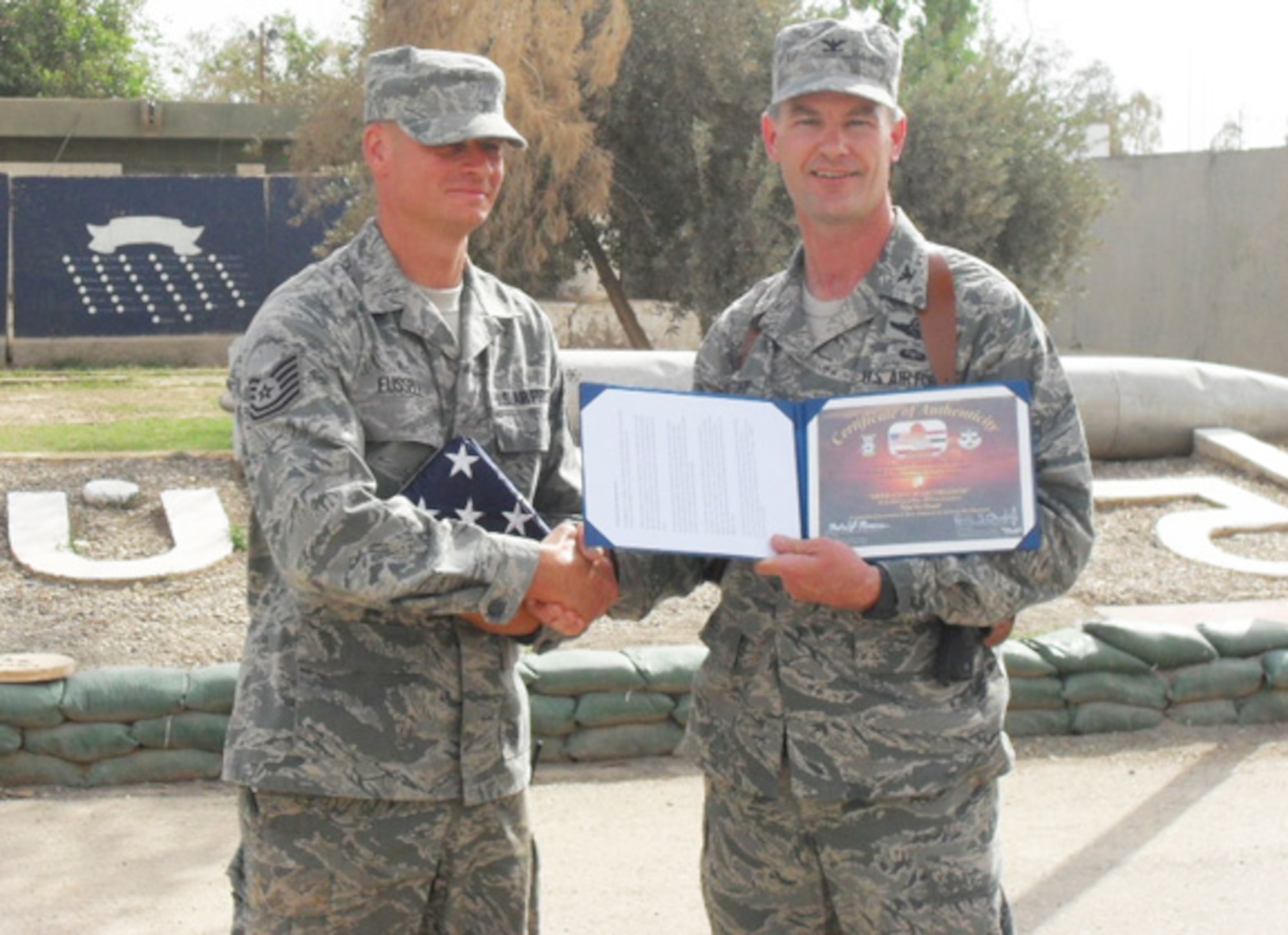 ELMENDORF AIR FORCE BASE, Alaska – Tech. Sgt. Ted Fussell, currently deployed to Kirkuk Regional Air Base, Iraq, with the 506th Expeditionary Civil Engineer Squadron, is a Reservist from Air Force Reserve Command’s 477th Fighter Group at Elmendorf Air Force Base, Alaska. He was recently promoted in his civilian job as a firefighter with the Anchorage Fire Department. Col. Eric Overturf, commander of the 506th Air Expeditionary Group and also deployed from the 477th FG, held a surprise ceremony in honor of Sergeant Fussell’s promotion to Senior Captain May 21. (Courtesy photo)