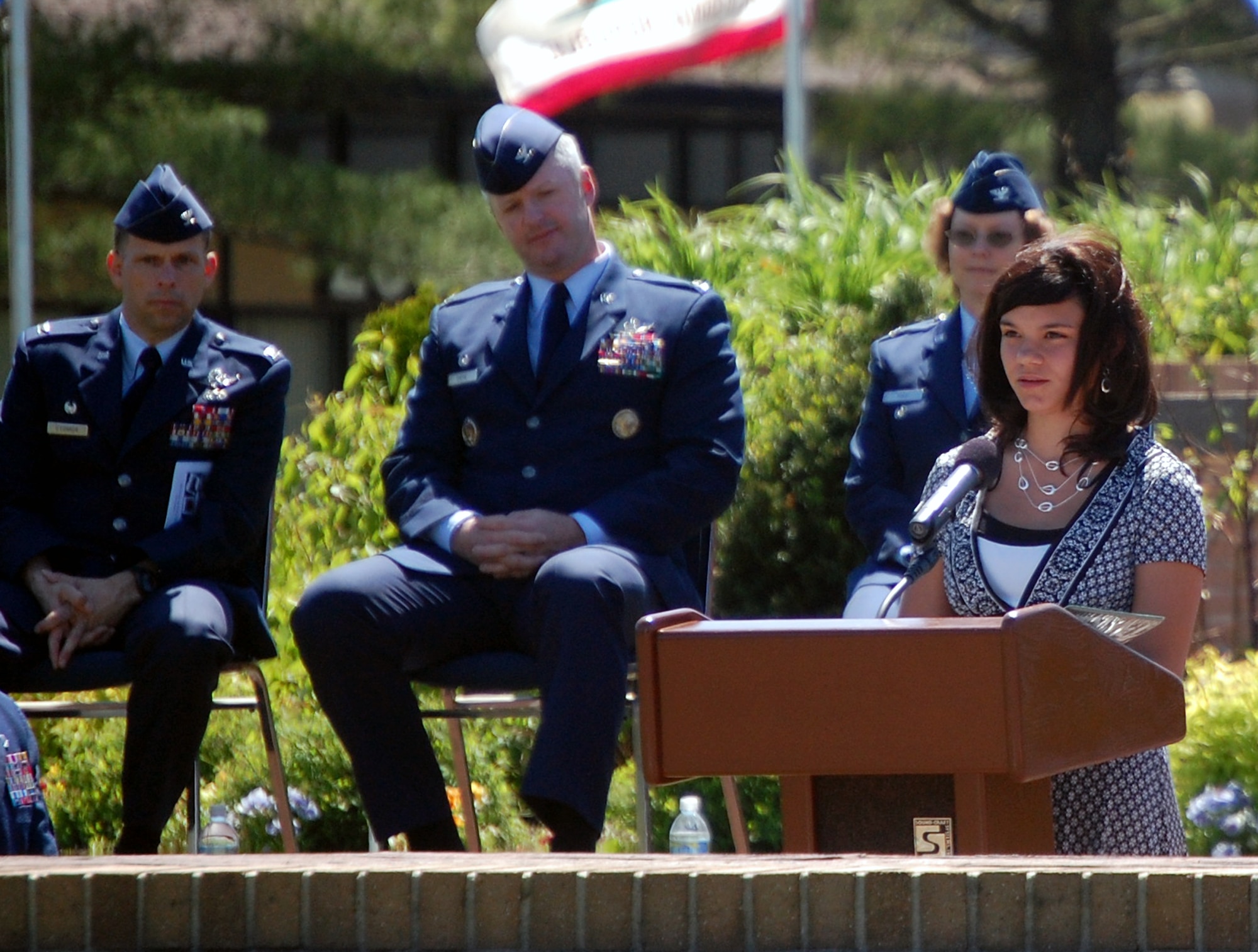 Madison Seiler, daughter of Nicole Seiler of the U.S. Aor Force Expeditionary Center and Tech. Sgt. David Seiler of the 305th Operations Support Squadron, reads her essay from the North Hanover Upper Elementary School during the 2009 Parade of Wreaths ceremony at Pudgy Circle on Joint Base McGuire-Dix-Lakehurst, N.J., on May 21.  The ceremony included members from all branches of the armed forces and from state and local police agencies.  The ceremony is held in observance of National Police Week and Memorial Day.  (U.S. Air Force Photo/Tech. Sgt. Scott T. Sturkol)