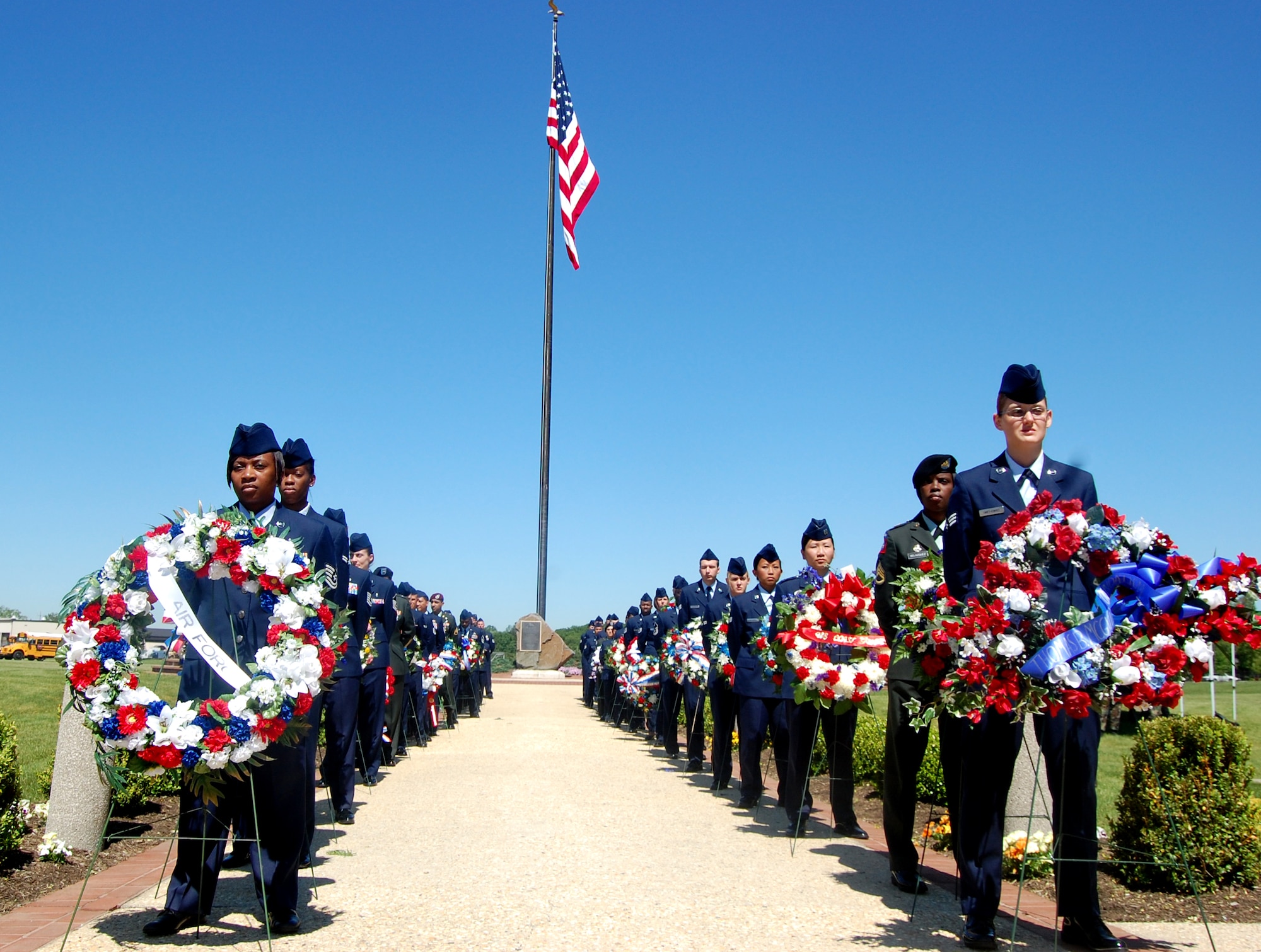 Airmen and Soldiers participate in the 2009 Parade of Wreaths ceremony at Pudgy Circle on Joint Base McGuire-Dix-Lakehurst, N.J., on May 21.  The ceremony included members from all branches of the armed forces and from state and local police agencies.  The ceremony is held in observance of National Police Week and Memorial Day.  (U.S. Air Force Photo/Tech. Sgt. Scott T. Sturkol)
