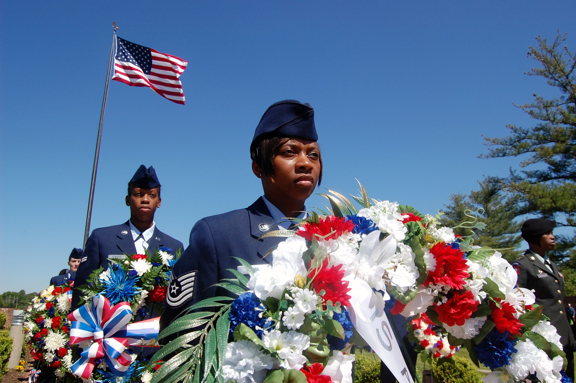 Airmen and Soldiers participate in the 2009 Parade of Wreaths ceremony at Pudgy Circle on Joint Base McGuire-Dix-Lakehurst, N.J., on May 21.  The ceremony included members from all branches of the armed forces and from state and local police agencies.  The ceremony is held in observance of National Police Week and Memorial Day.  (U.S. Air Force Photo/Tech. Sgt. Scott T. Sturkol)