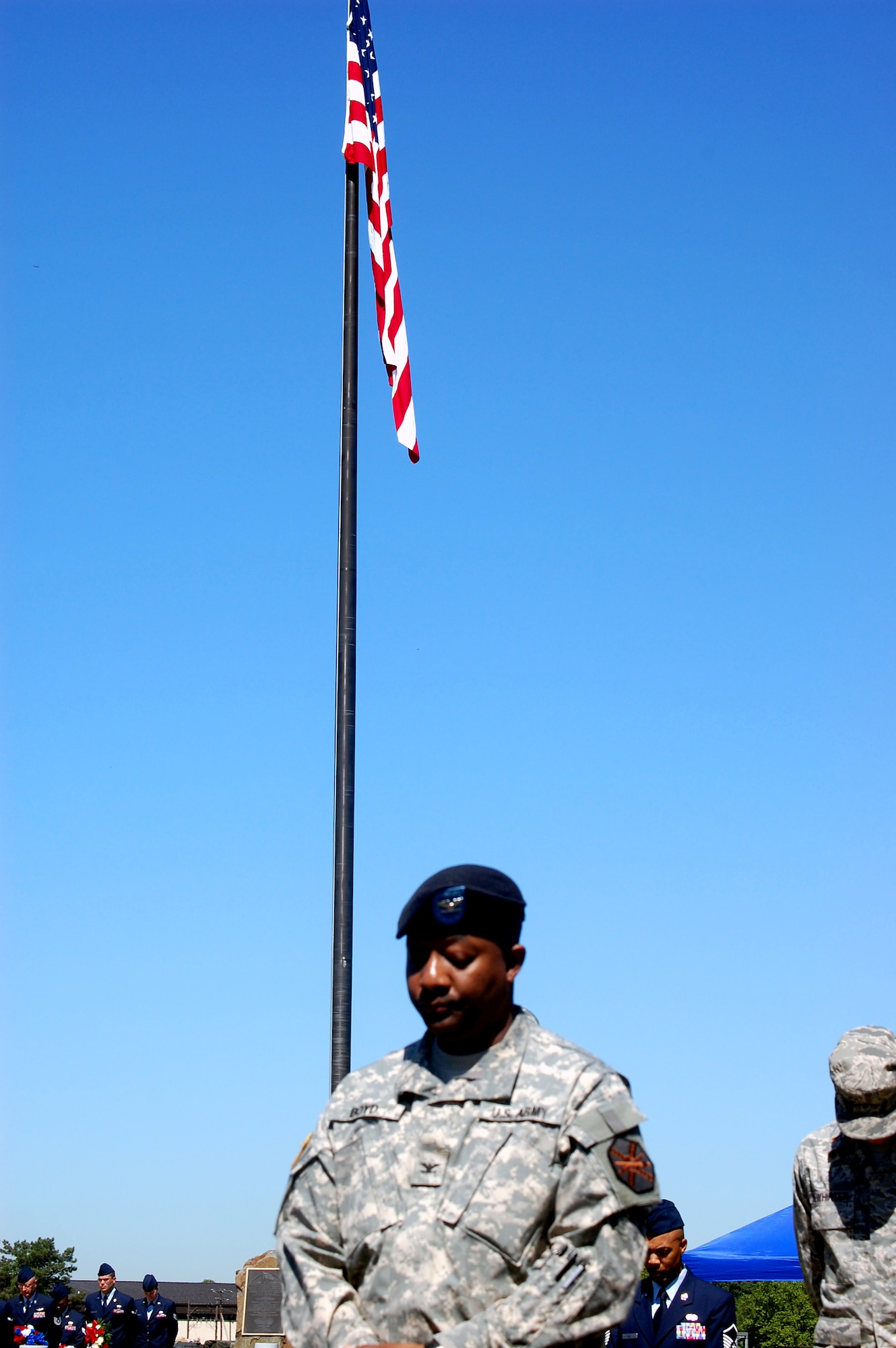 Airmen and Soldiers paticipate in the invocation during the 2009 Parade of Wreaths ceremony at Pudgy Circle on Joint Base McGuire-Dix-Lakehurst, N.J., on May 21.  The ceremony included members from all branches of the armed forces and from state and local police agencies.  The ceremony is held in observance of National Police Week and Memorial Day.  (U.S. Air Force Photo/Tech. Sgt. Scott T. Sturkol)