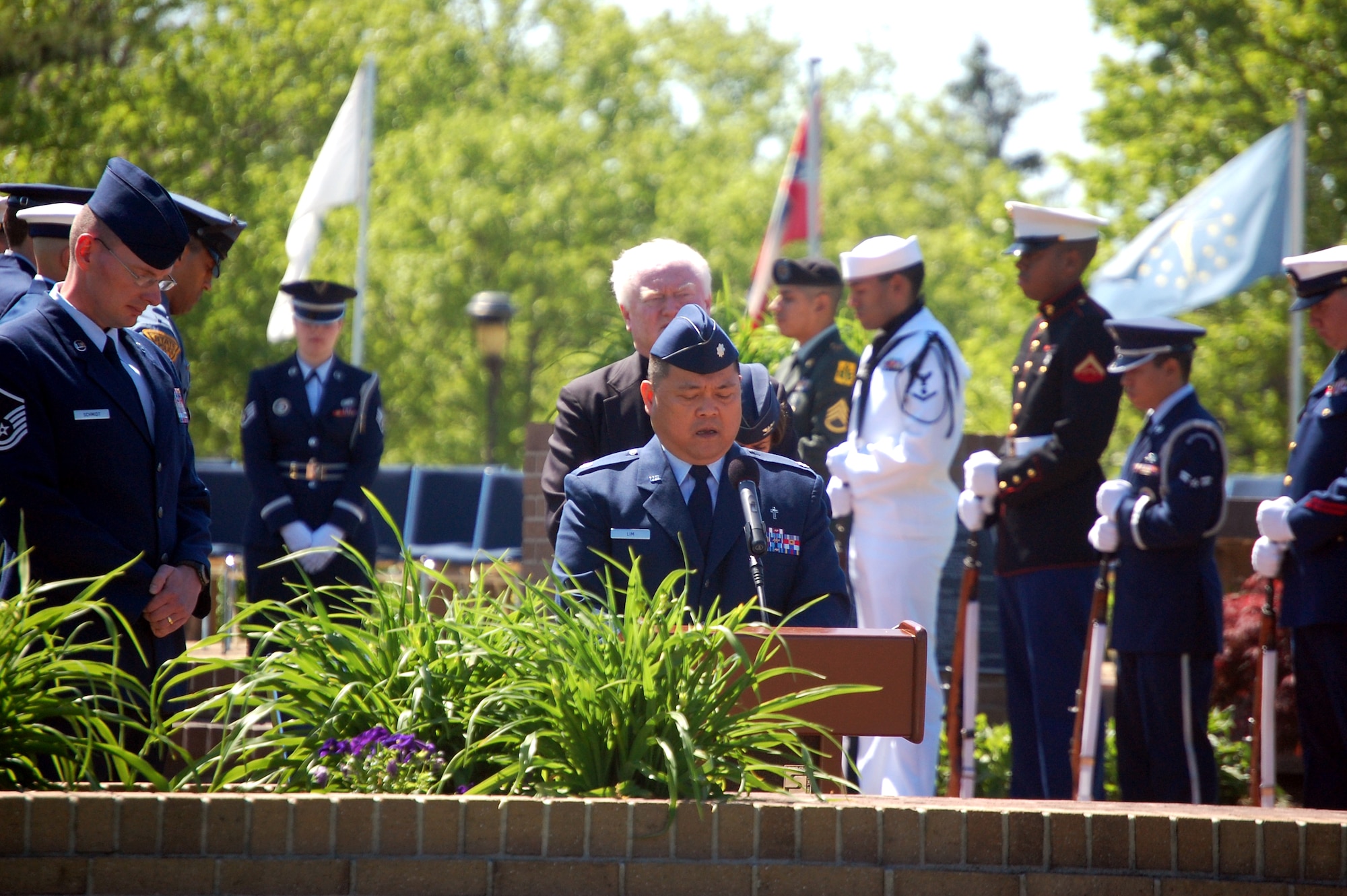 Chaplain (Lt. Col.) Joseph Lim (center), from the 87th Air Base Wing chapel, gives the invocation during the 2009 Parade of Wreaths ceremony at Pudgy Circle on Joint Base McGuire-Dix-Lakehurst, N.J., on May 21.  The ceremony included members from all branches of the armed forces and from state and local police agencies.  The ceremony is held in observance of National Police Week and Memorial Day.  (U.S. Air Force Photo/Tech. Sgt. Scott T. Sturkol)
