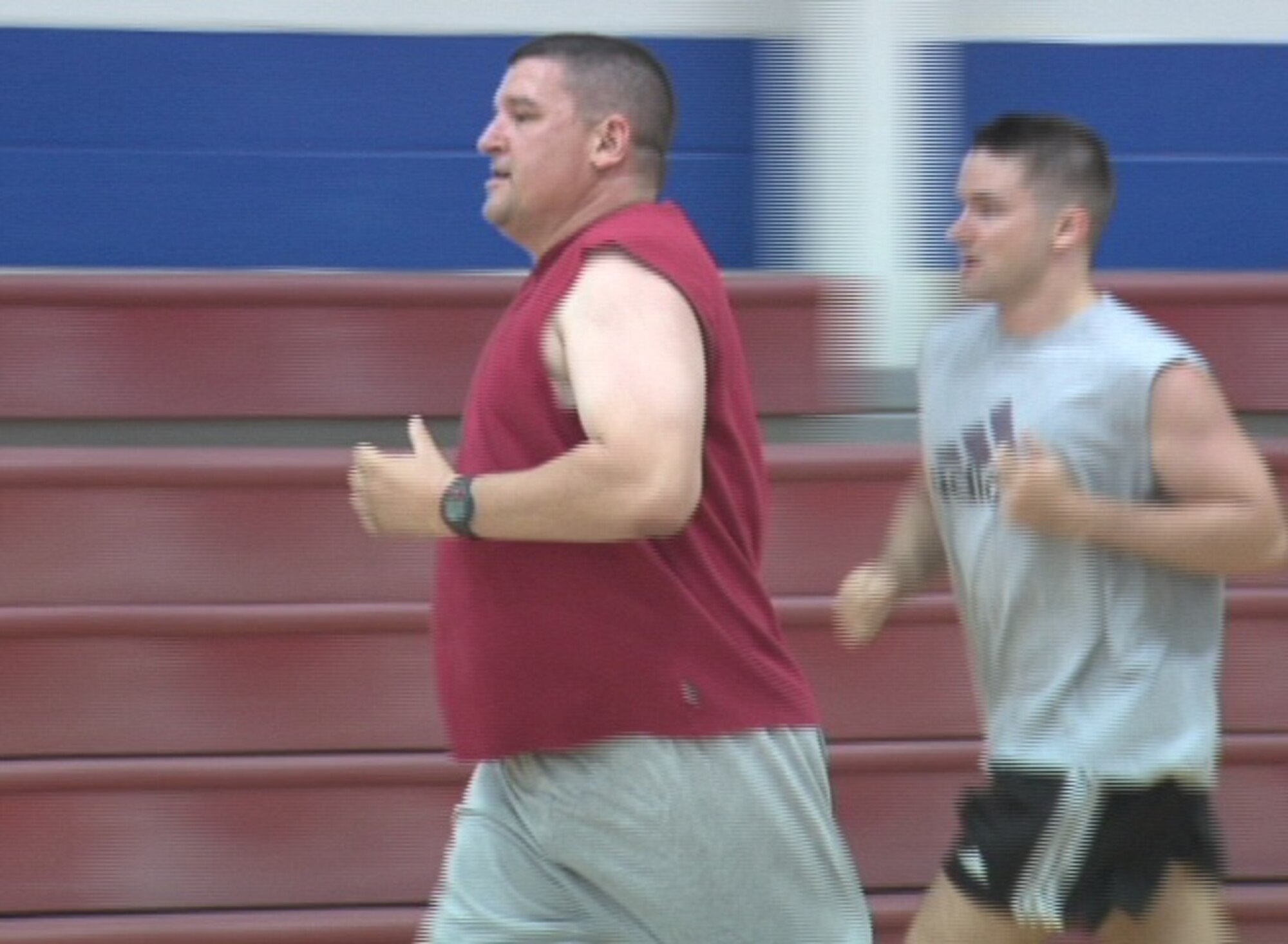 ALTUS AIR FORCE BASE, Okla. -- Tech. Sgt. T.J. Sinclair, 54th Air Refueling Squadron, runs laps around the basketball court during the core fitness class May 22. The fast-paced class was established by the Health and Wellness Center staff to help improve core strength and overall fitness. Sergeant Sinclair attends the class as part of his training regimen, preparing for his annual fitness test. (U.S. Air Force photo/Kenneth A. Scarle)