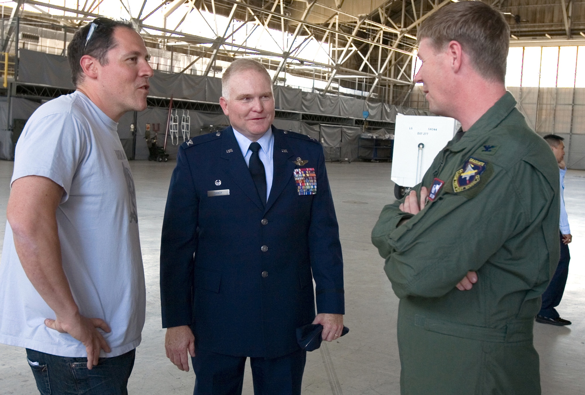 "Ironman II" director Jon Favreau (left to right) talks to Col. Jerry Gandy and Col. William Thorton during a break from the shooting of "Ironman II" May 13 at Edwards Air Force Base, Calif. Colonel Thorton is the 412th Test Wing commander and Colonel Gandy is the 95th Air Base Wing commander. (U.S. Air Force photo/Jet Fabara) 
