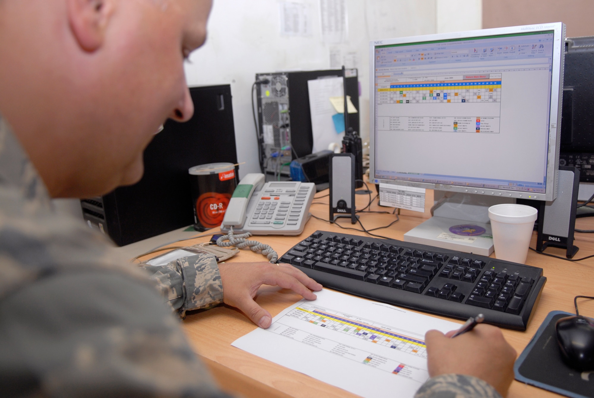 Tech. Sgt. Jeff Evanson, the 379th Expeditionary Maintenance Operations Squadron (EMOS) C-130 Scheduler, checks the monthly maintenance schedule, May 27, 2009, at an undisclosed location in Southwest Asia.  The EMOS Plans and Scheduling unit schedules the maintenance on the unit's aircraft.  Sergeant Evanson hails from Sparta, Wis. and is deployed from the 934th Airlift Wing Air Reserve Station, Minn., in support of Operations Iraqi and Enduring Freedom and Combined Joint Task Force - Horn of Africa.  (U.S. Air Force photo/Senior Airman Andrew Satran/released)