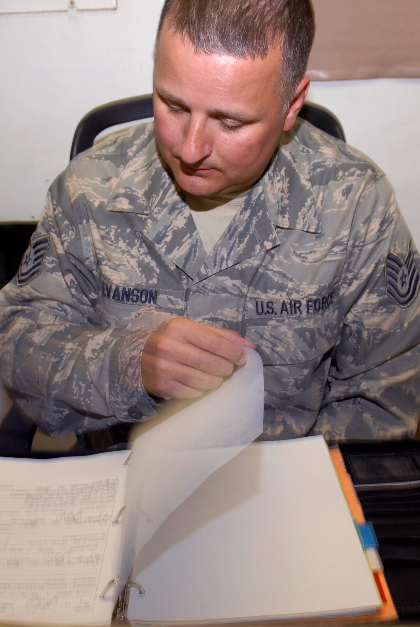 Tech. Sgt. Jeff Evanson, the 379th Expeditionary Maintenance Operations Squadron (EMOS) C-130 Scheduler, checks the maintenance forms for the unit's aircraft, May 27, 2009, at an undisclosed location in Southwest Asia.  The EMOS Plans and Scheduling unit schedules the maintenance on the unit's aircraft.  Sergeant Evanson hails from Sparta, Wis. and is deployed from the 934th Airlift Wing Air Reserve Station, Minn., in support of Operations Iraqi and Enduring Freedom and Combined Joint Task Force - Horn of Africa.  (U.S. Air Force photo/Senior Airman Andrew Satran/released)