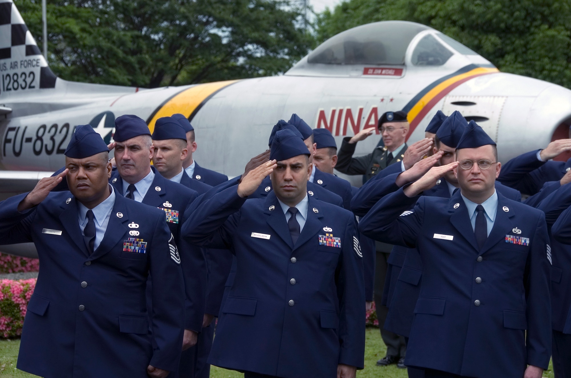 YOKOTA AIR BASE, Japan -- Yokota Airmen render salutes during the National Anthem May 25 during the Veterans of Foreign Wars Post 9555 Memorial Day ceremony near Nina Circle. Gen. John A. Logan, commander of the Grand Army of the Republic , officially proclaimed Memorial Day on May 5, 1868. The holiday was first observed on May 30, 1868, when flowers were placed on the graves of Union and Confederate soldiers at Arlington National Cemetery. (U.S. Air Force photo/Master Sgt. Matt Summers)