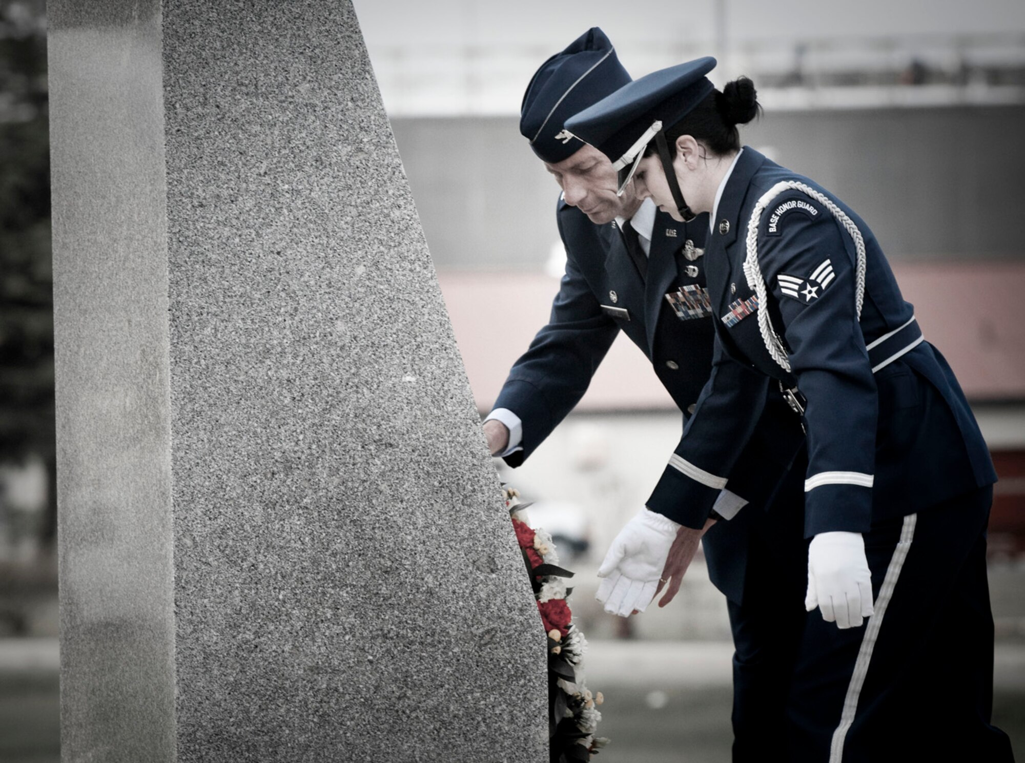 MISAWA AIR BASE, Japan -- Col. David Stilwell, 35th Fighter Wing commander, and Senior Airman Sarah Golloway, a Misawa Air Base honor guardsman, lay a wreath in Risner Circle in honor of Memorial Day May 21, 2009. The residents of Misawa Air Base gathered at Risner Circle to honor servicemembers who paid the ultimate sacrifice. (U.S. Air Force photo illustration by Staff Sgt. Samuel Morse)