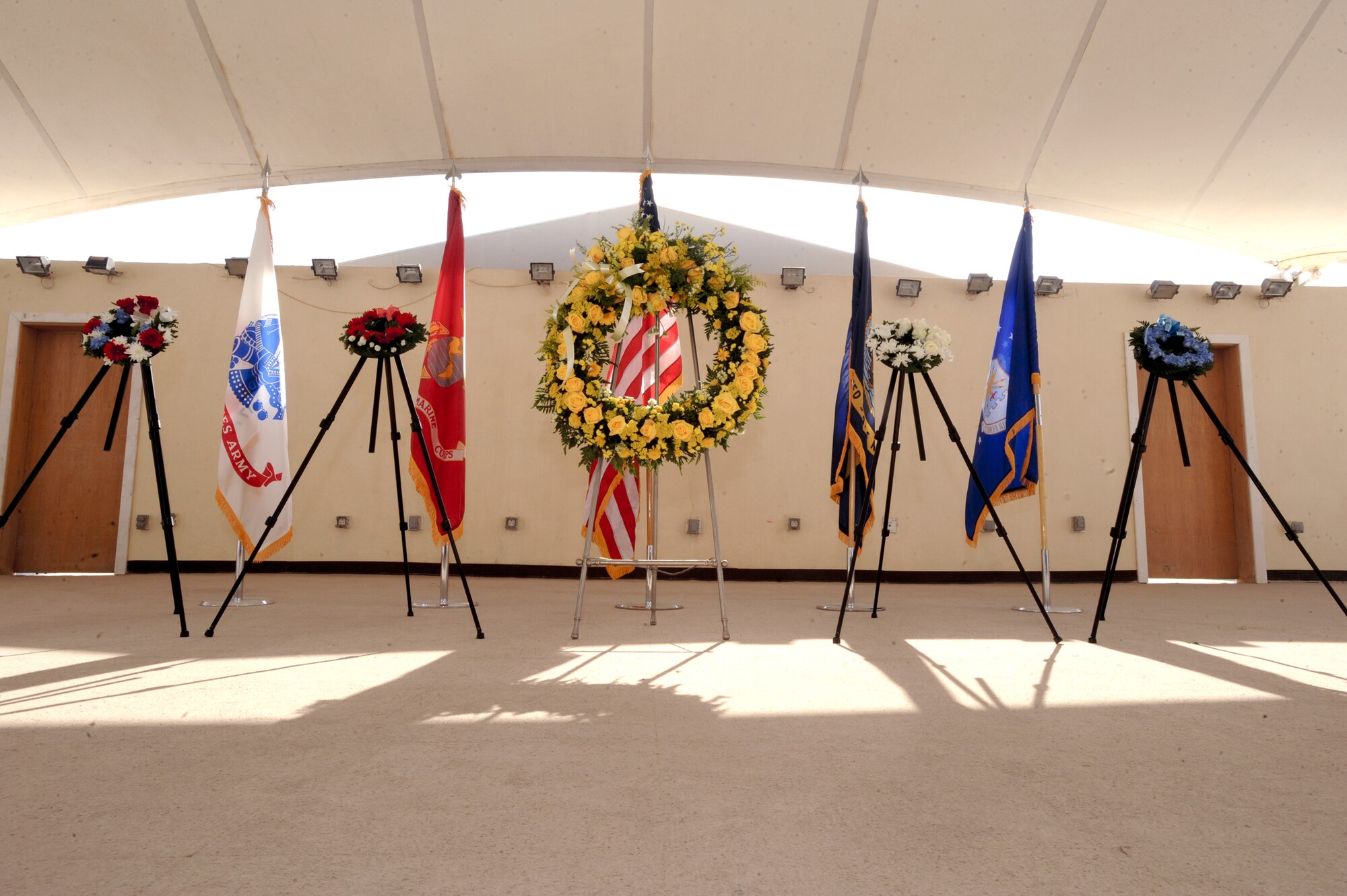 Wreaths representing the individual military branches and the Department of Defense stand as a remembrance of those who have died in service to the United States. Members of the 379th Air Expeditionary Wing honored those sacrifices with an early morning wreath laying ceremony to begin this Memorial Day and ensure their contributions are not forgotten.  (U.S. Air Force Photo by Staff Sgt. Joshua Garcia/released)