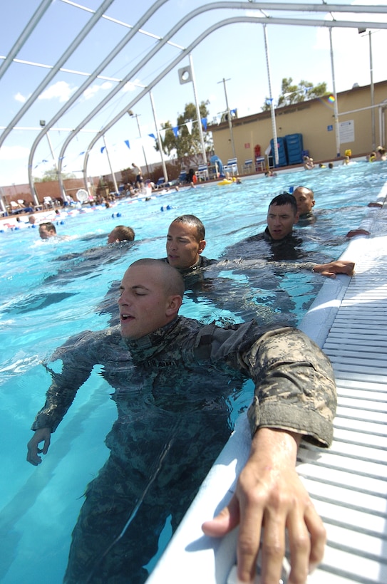 Pre-Ranger students recite the Ranger Creed as they tread water during the combat water survival assessment portion of the Pre-Ranger Course in the Mojave Desert, Fort Irwin, Calif., May 18, 2009.
