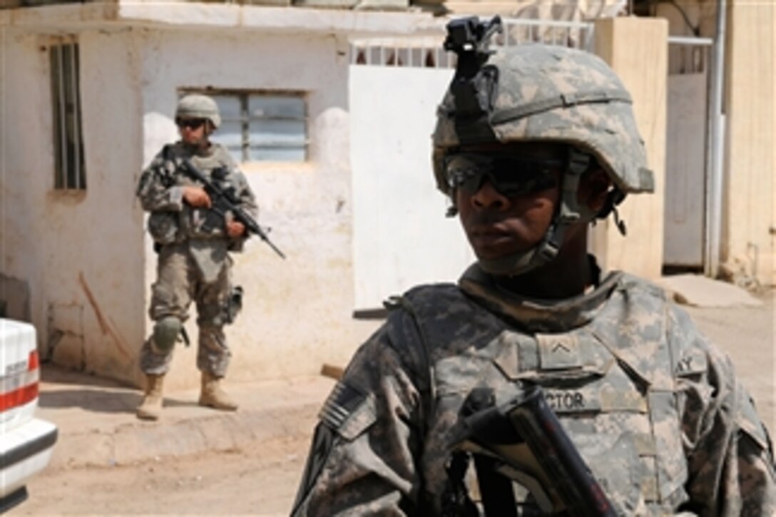 U.S. Army Pvt. Deonta Proctor provides security during a patrol in the city of Kirkuk, Iraq, on May 17, 2009.  Proctor is an infantryman, attached to 1st Platoon, Charlie Company, 1st Battalion, 8th Cavalry Regiment, 2nd Heavy Brigade Combat Team, 1st Cavalry Division, Fort Hood, Texas.  