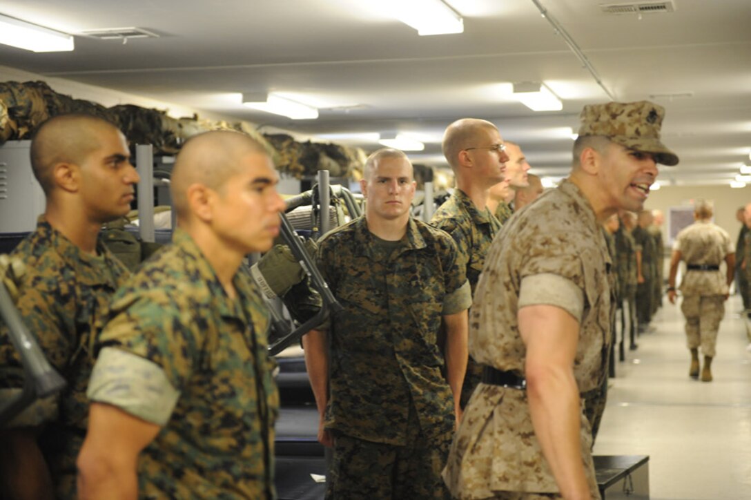 Candidates from Echo Company, Officer Candidate School,  meet their instructor staff on pick-up day and are given a taste of how their training will be conducted while aboard Marine Corps Base Quantico, Va., Wednesday, May 27, 2009. The candidates face 6-weeks of rigorous and demanding training that serves to screen and evaluate their leadership skills and determine whether they can efficiantly lead Marines. (U.S. Marine Corps photo by LCpl John Kennicutt/Not Released)