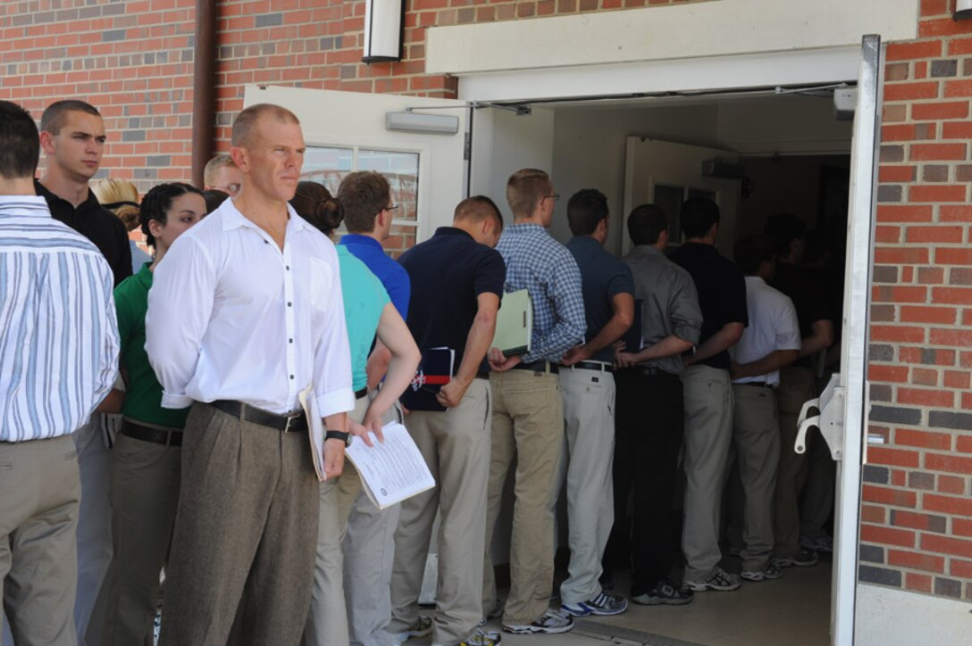 Newly arrived candidates from Alpha Company, Officer Candidate School, check in to OCS aboard Marine Corps Base Quantico, Va., Thursday, May 28, 2009. A newly released MARADMIN details major changes coming to enlisted to officer commissioning programs.