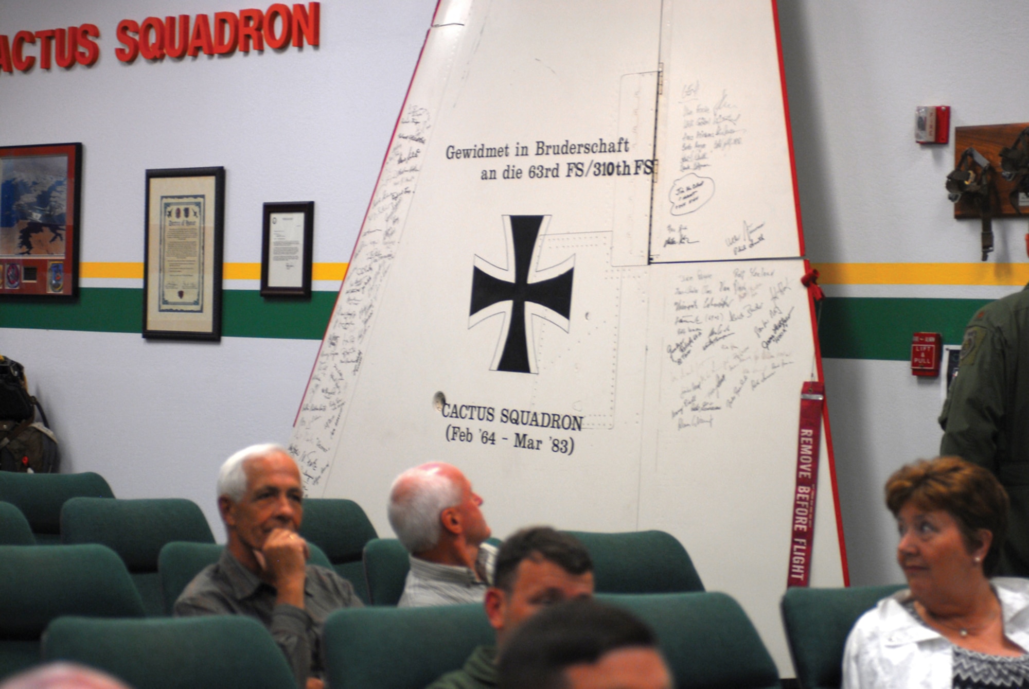 The Cactus Starfighter Squadron F-104 wing sits on display in the 310th Fighter Squadron conference room after the CSS realignment May 22 in Blgd. 904. U.S. Air Force photo/ Airman 1st Class Tracie Forte)