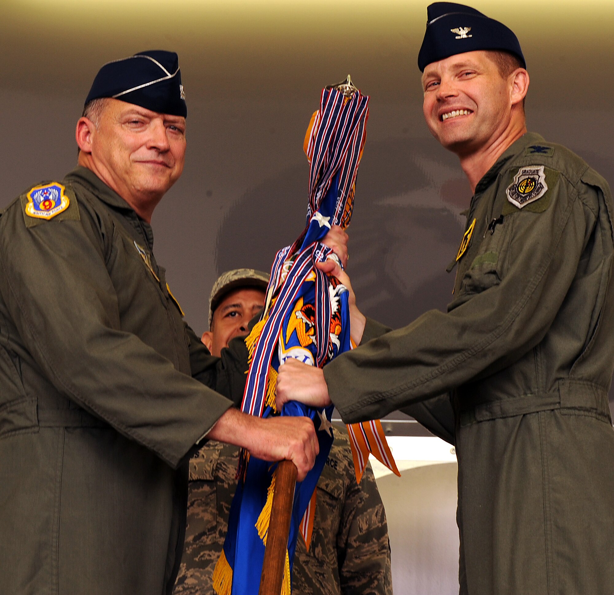 MOODY AIR FORCE BASE, Ga. -- Lt. Gen. Gary North, 9th Air Force and U.S. Air Force Central commander, presents the guidon to Col. Gary Henderson, 23rd Wing commander here May 28. Colonel Henderson assumed command of the 23rd WG during a change of command ceremony. (U.S. Air Force photo by Airman 1st Class Joshua Green)