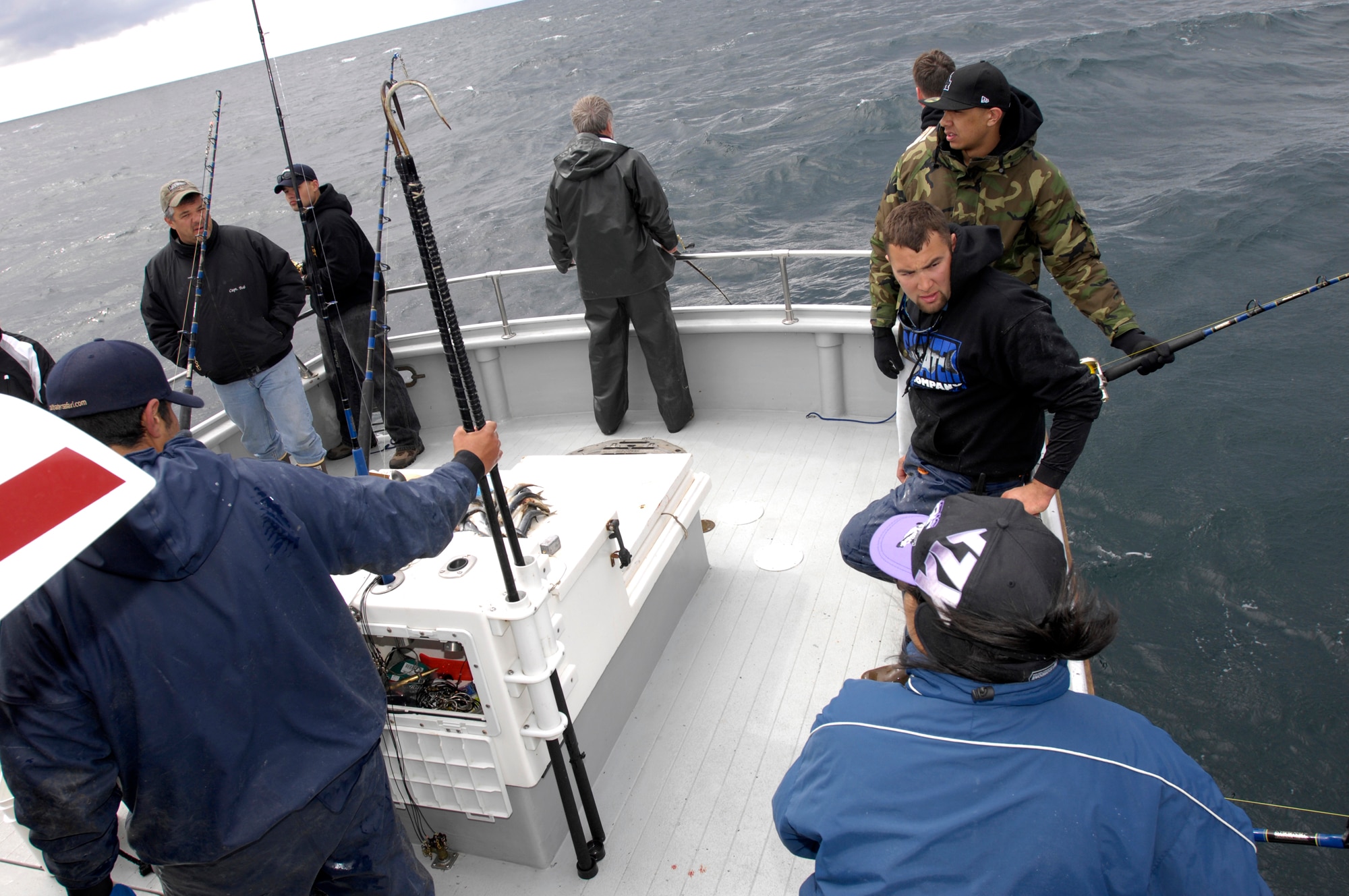 SEWARD, Alaska -- Servicemembers and crew members of the “Legend” relax and talk to one another as during the third annual Armed Services Combat Fishing Tournament May 21, 2009. The tournament, sponsored by the Armed Services YMCA and the Seward Charter Association, is a free day of halibut charter fishing mainly for veterans of the Iraq and Afghanistan war. (U.S. Air Force photo/Airman 1st Class Christopher Gross)