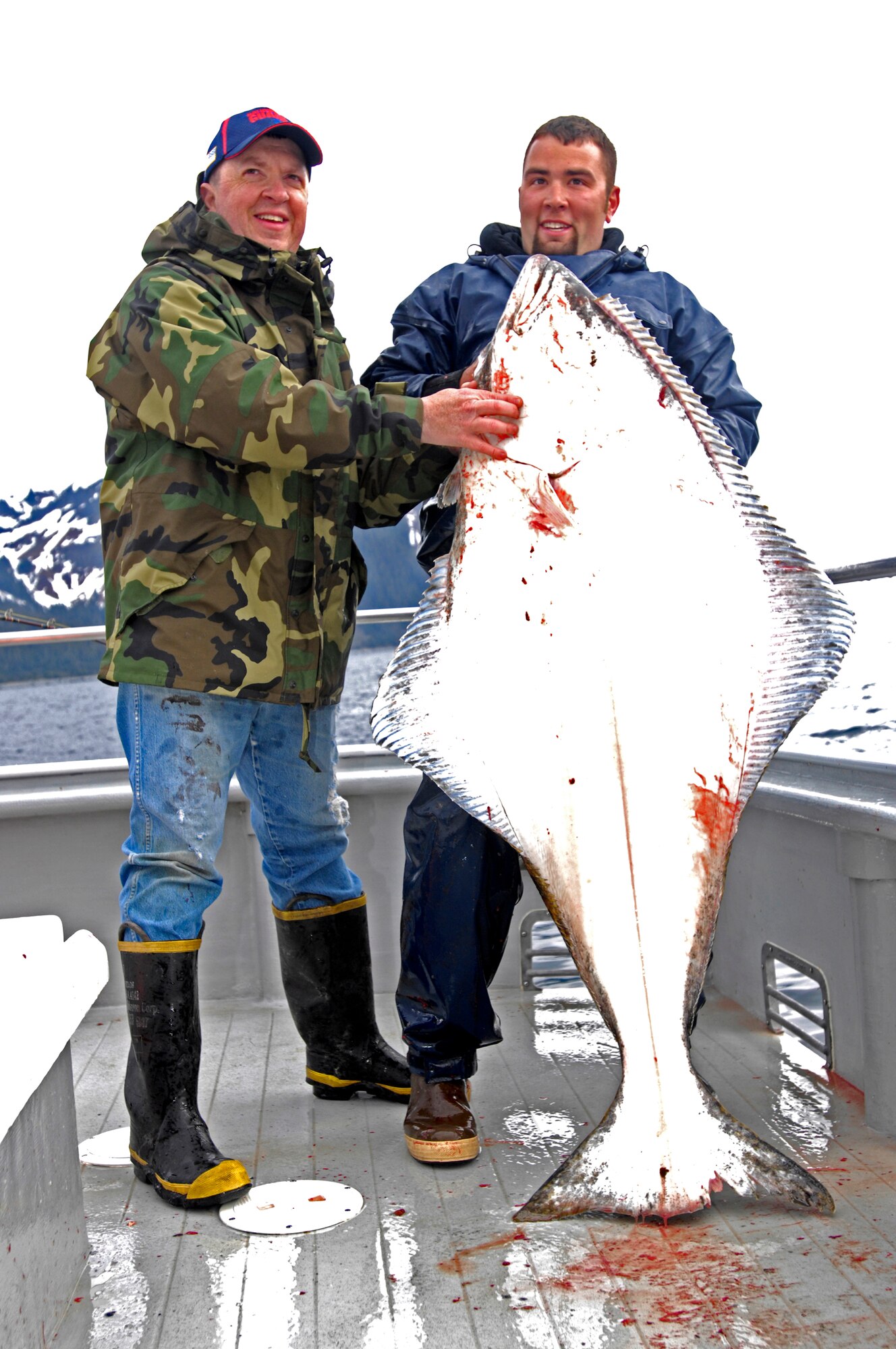 SEWARD, Alaska -- Duane Middleton with deck hand Jeff Eide shows off his 90-pound halibut May 21, 2009. Middleton is part of the Alaska Army National Guard and was deployed to Kuwait from July 2006 to November 2007. The tournament, sponsored by the Armed Services YMCA and the Seward Charter Association, is a free day of halibut charter fishing mainly for veterans of the Iraq and Afghanistan war.  
(U.S. Air Force photo/Airman 1st Class Christopher Gross)
