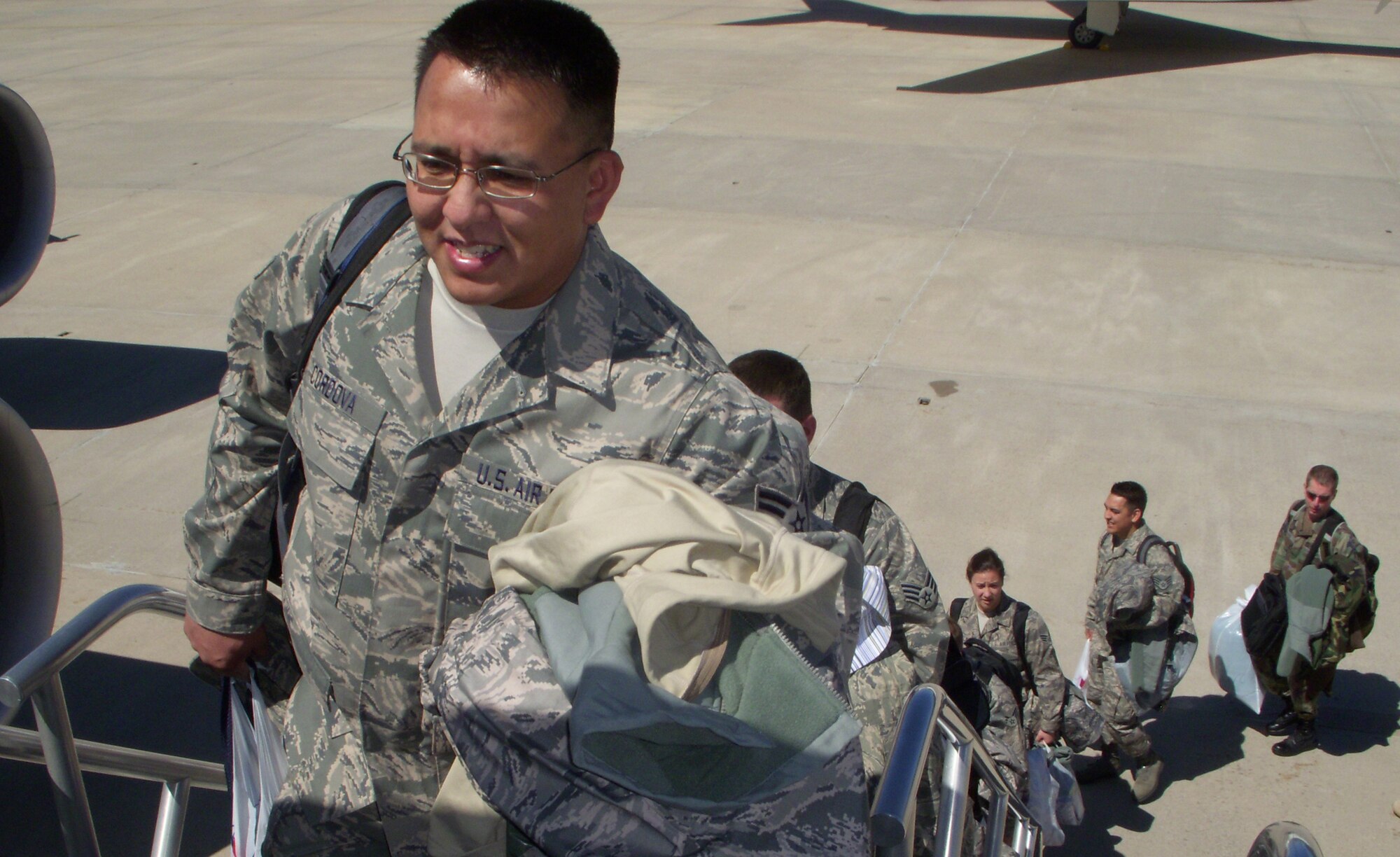 Senior Airman Joseph Cordova, 302nd Communications Flight computer operator, boards a KC-135 May 27 bound for Ramstein Air Base, Germany. More than 20 members of the 302nd CF departed Peterson Air Force Base, Colo., for two weeks to perform annual tour duty in support of Ramstein's communication mission. Many active duty Airmen in the communications career field at the air base have been forward deployed to Iraq and Afghanistan in support Operations Iraqi and Enduring Freedom. The KC-135, based at McConnell AFB, Kan., is assigned to the AF Reserve's 931st Air Refueling Group. (U.S. Air Force photo/Senior Airman Stephen J. Collier)