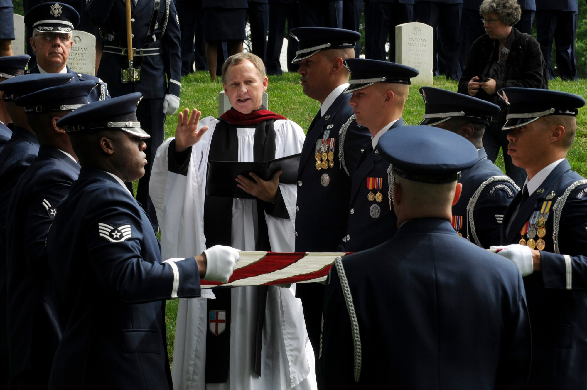 Members of a U.S. Air Force Honor Guard body bearer’s element fold the U.S. flag over the remains of former Chief Master Sgt. of the Air Force Paul W. Airey, during a funeral in his honor 28 May, at Arlington National Cemetery in Arlington Va. Former CMSAF Airey was adviser to Secretary of the Air Force Harold Brown and Chief of Staff of the Air Force Gen. John P. McConnell on matters concerning welfare, effective utilization and progress of the enlisted members of the Air Force. Former CMSAF Airey was the first chief master sergeant appointed to this ultimate noncommissioned officer position and was selected from among 21 major air command nominees to become the first chief master sergeant of the Air Force. (U.S. Air Force photo by Staff Sgt. Dan DeCook)