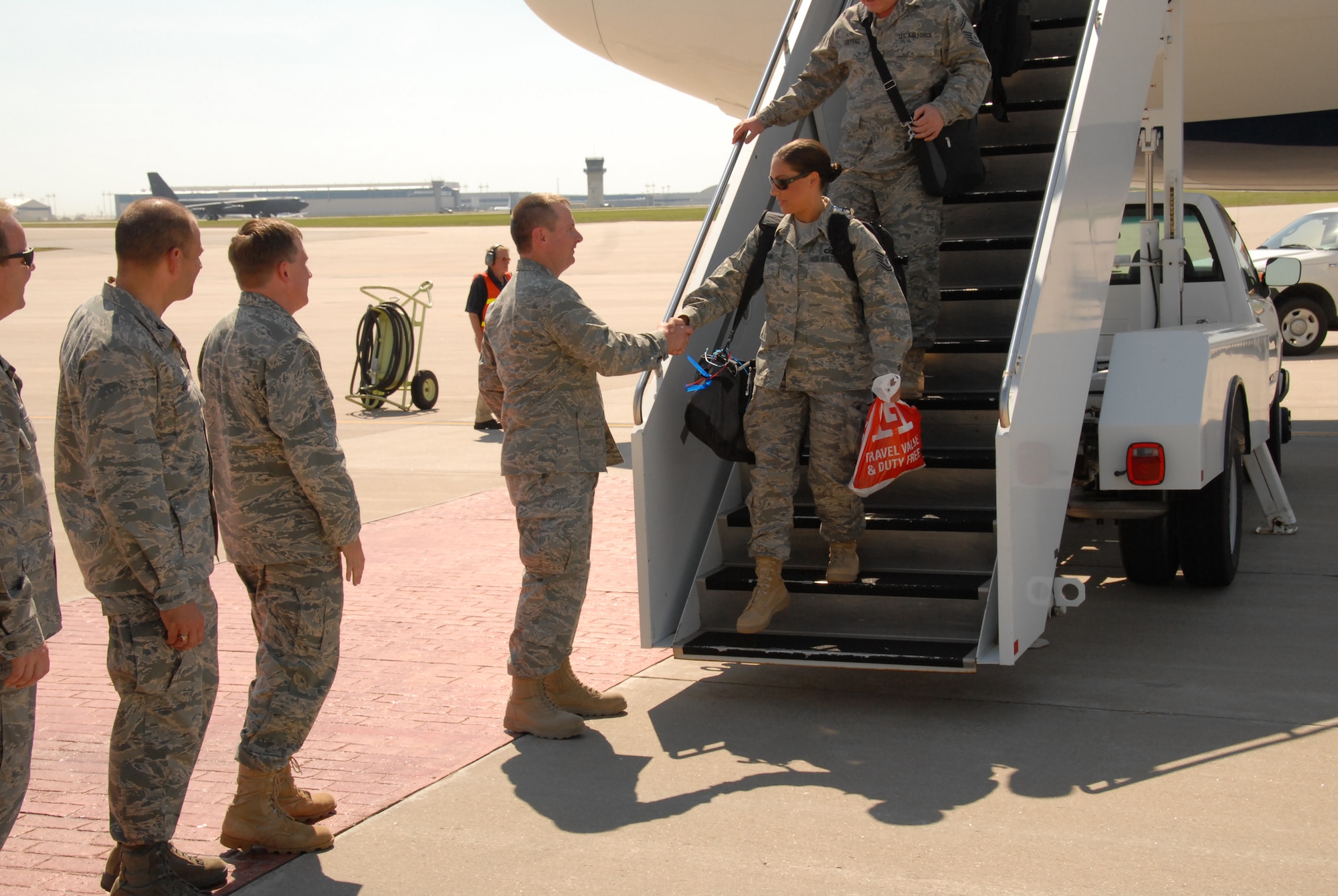 TSgt Kristina Kapaun, of the KSANG 184th Intelligence Wing’s 134th Air Control Squadron, is the first to be greeted by the Kansas Adjutant General, Maj Gen Tod Bunting, at McConnell AFB after serving on deployment at Joint Base Balad, Iraq.