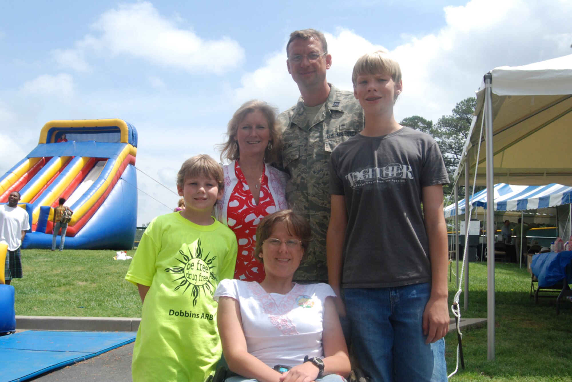Chaplain (Capt.) Doug Collins poses with his family during Dobbins Family Day 2009 at the Lakeside. From left: son, Jordan; wife, Jill; daughter, Cameron; and son, Copelan. Chaplain Collins recently returned from a deployment to Southwest Asia, and his family has attended Family Day for the past four years. (U.S. Air Force photo/Senior Airman Shaun Shenk)