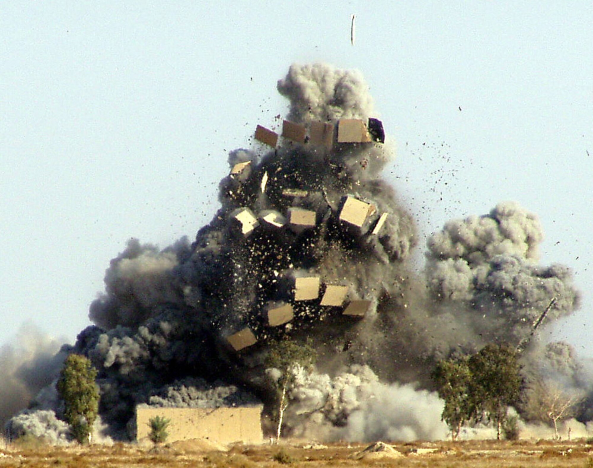 EGLIN AIR FORCE BASE, Fla. -- An explosion left from a Joint Direct Attack Munition propels debris in the air during a test. The 780th Test Squadron tests air-to-air, air-to-ground, and ground testing on munitions. (Air Force photo)