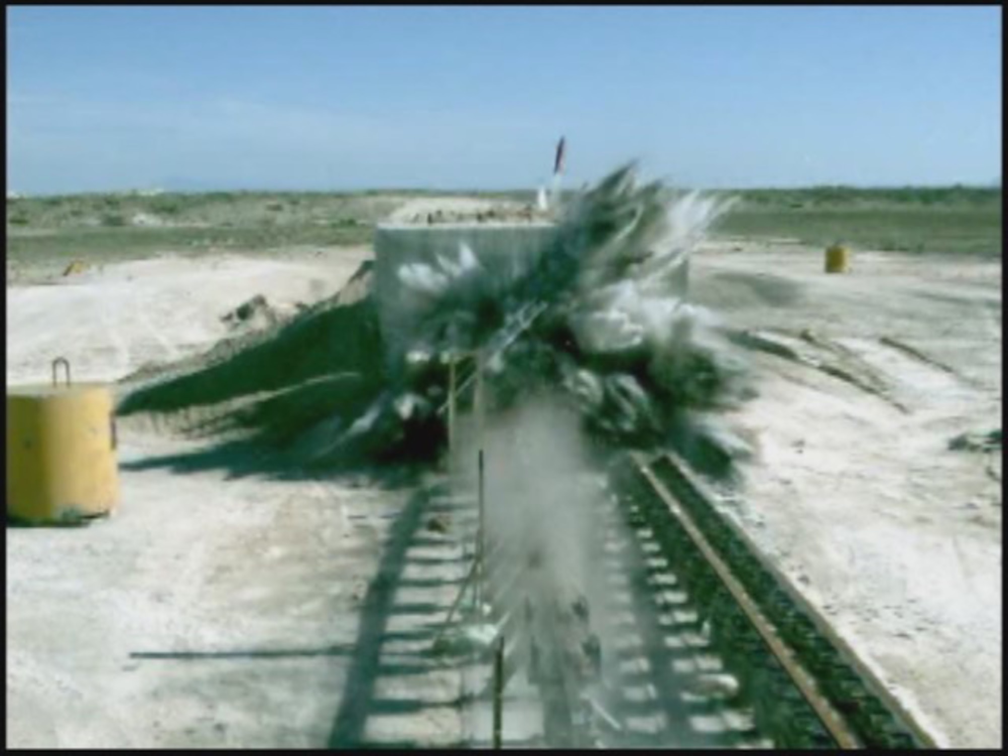 EGLIN AIR FORCE BASE, Fla. -- A munition can be seen exiting a barrier on the sled track during a weapons test at Eglin. The 780th Test Squadron executes weapons testing for air-to-air, air-to-ground and ground test weapons. (Air Force photo)