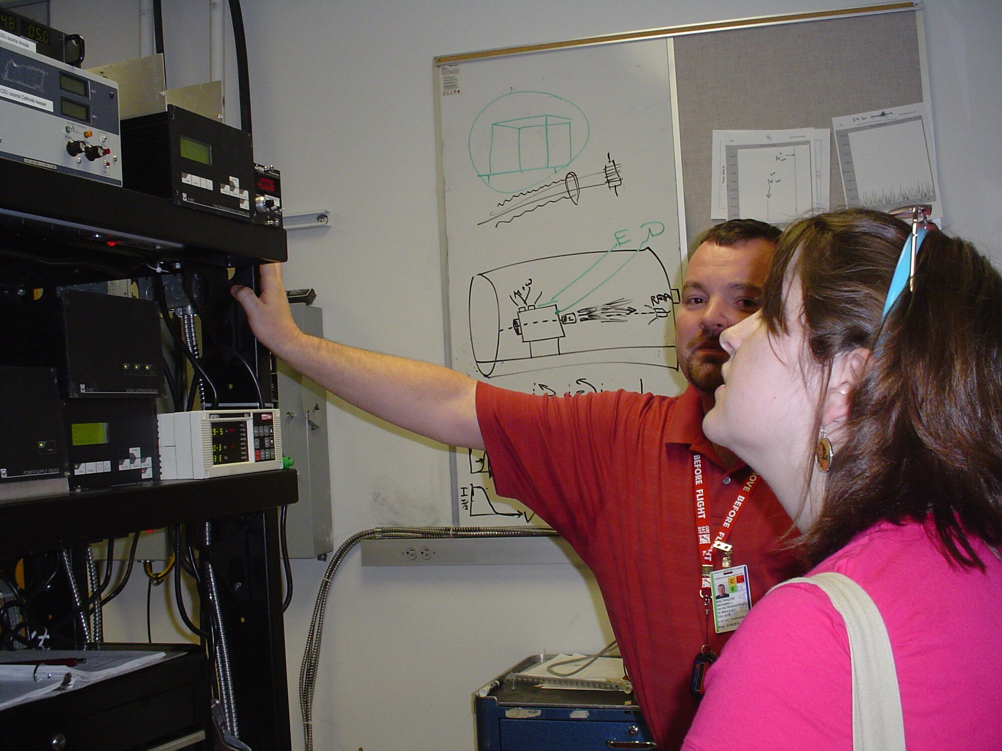 Faculty at the U.S. Air Force Academy Space Physics and Atmospheric Research Center demonstrate the equipment used in their lab to a small group of students as part of the 47th National Junior Sciences Humanities and Symposium held in Colorado Springs, Colo. (U.S. Air Force photo/LeAndrea White)