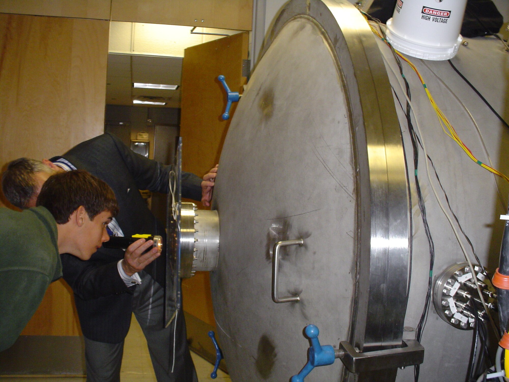 Dr. Geoff McHarg, director of the U.S. Air Force Academy Space Physics and Atmospheric Research Center, gives a private tour of the lab to a small group of students as part of the 47th National Junior Sciences Humanities and Symposium held in Colorado Springs, Colo. (U.S. Air Force photo/LeAndrea White)