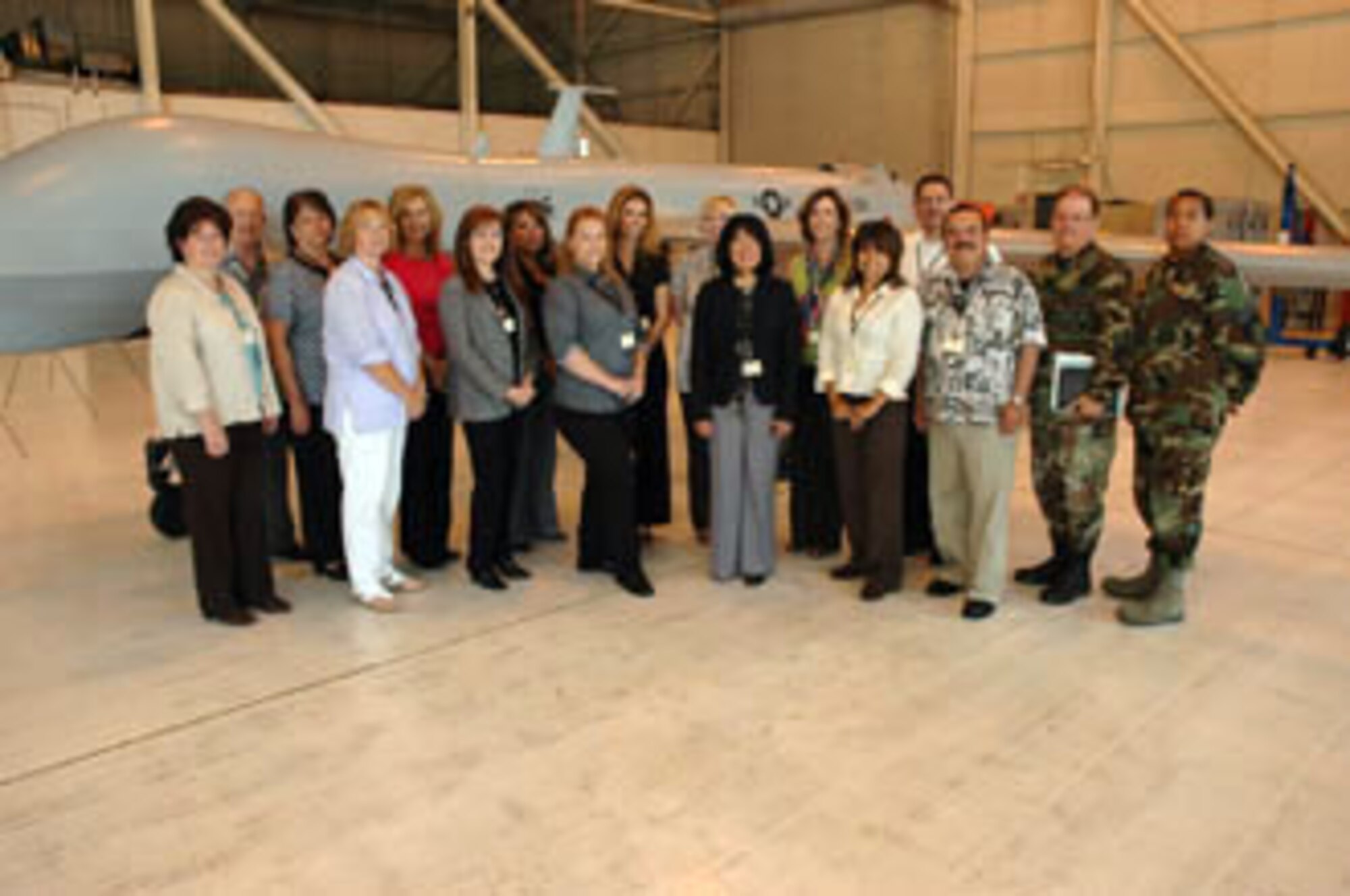 The 2009 class of Leadership Moreno Valley pose by a Predator static display during their tour of the base last week. The program brings together individuals who are interested in understanding local public concerns and issues. The nine month curriculum consists of sessions in government, business, media, health and human services, education, public safety, natural resources, military and quality of life. The group visited the 144th Fighter Wing, 163rd Reconnaissance Wing, C-17 simulator and Air and Marine Operations Center. (U.S. Air Force photo by Senior Amn. Paul Duquette, 163d RW)