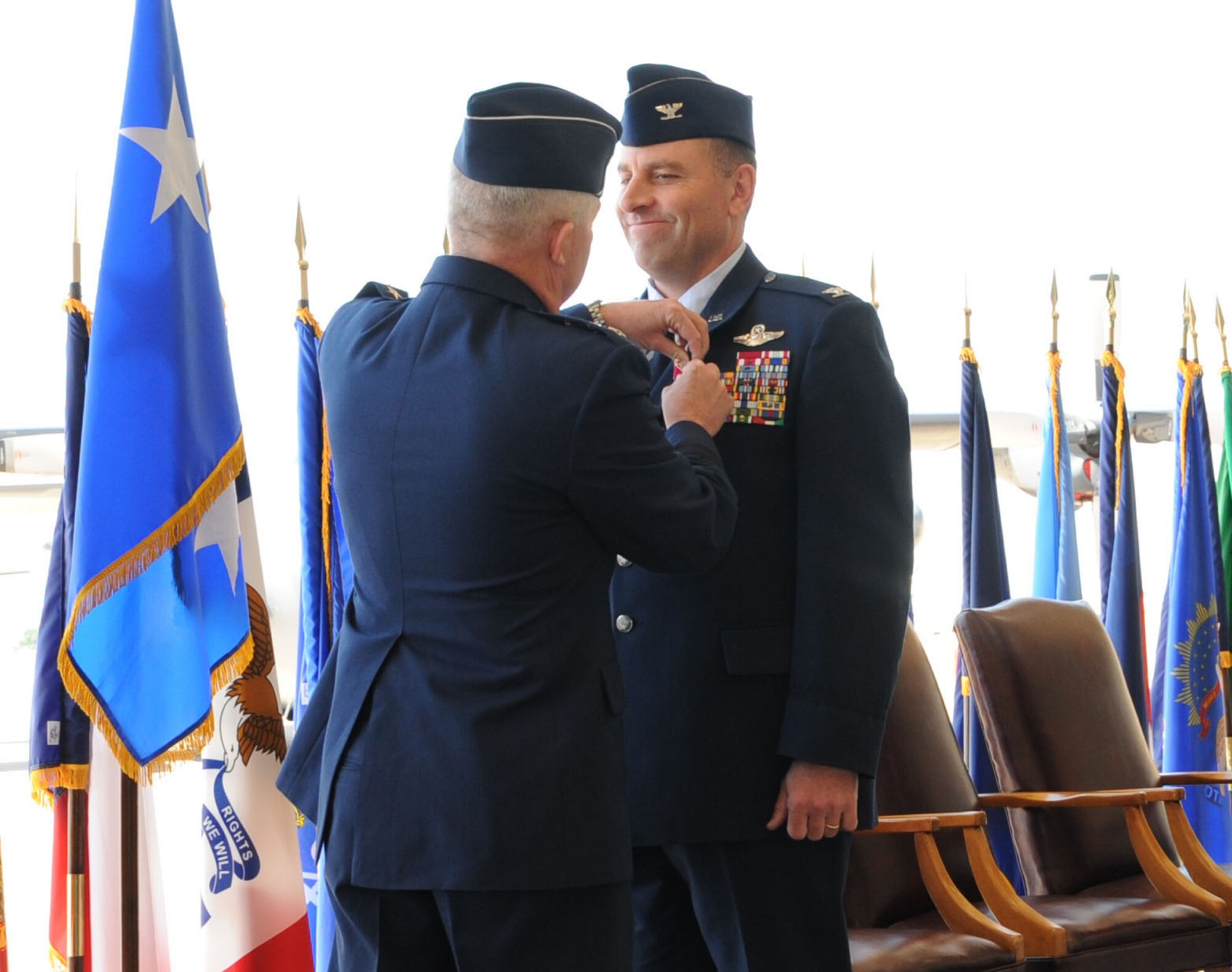 CANNON AIR FORCE BASE, N.M. -- Lt. Gen Donald C. Wurster, Air Force Special Operations Command commander, awards a Legion of Merit to Col. Timothy J.  Leahy during a change of command May 27. Colonel Leahy, who relinquished command of the 27th Special Operations Command to Col. Stephen A. Clark, will become special assistant to the commander, U.S. Special Operations Command. (U.S. Air Force photo by Airman 1st Class Maynelinne De La Cruz)