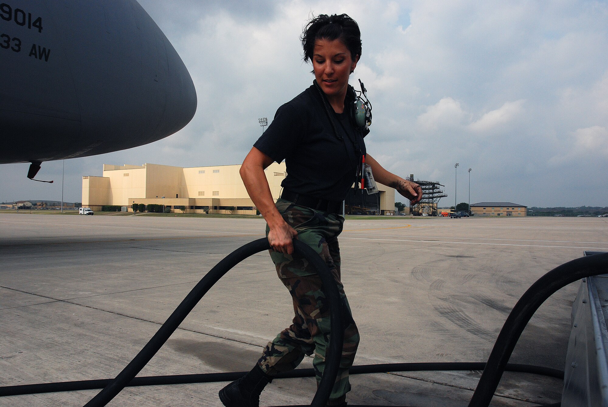 Staff Sgt. Mikela Kleinhans, a Reservist from the 433rd Airlift Wing's Aircraft Maintenance Squadron, goes through routine checks and inspections in a C-5A Galaxy cargo aircraft at Lackland AFB. Sergeant Kleinhans' job as a crew chief for a C-5 takes her all over the world with the aircraft. (U.S. Air Force photo/Airman Brian McGloin)