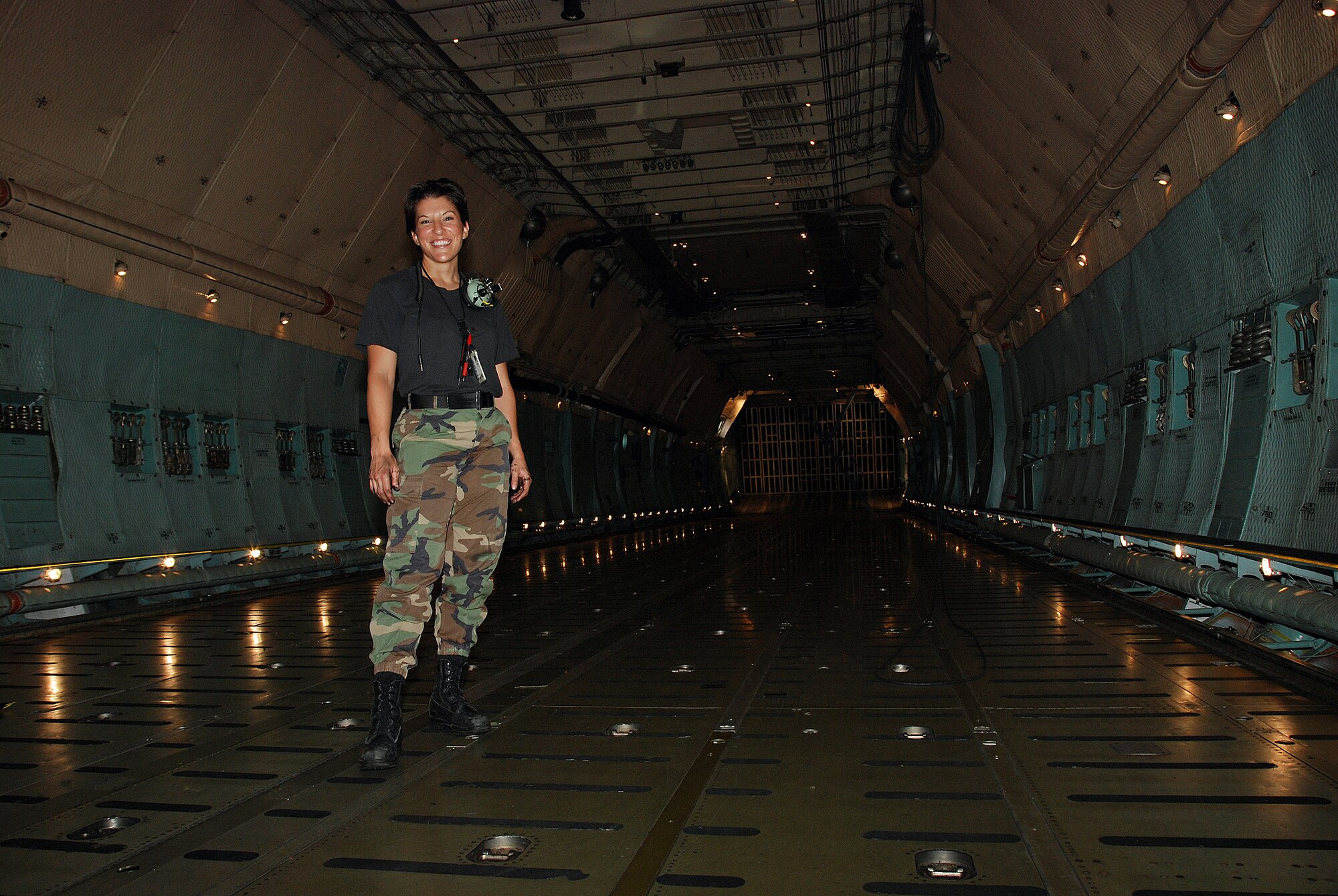 Staff Sgt. Mikela Kleinhans, a Reservist from the 433rd Airlift Wing's Aircraft Maintenance Squadron goes through routine checks and inspections in a C-5A Galaxy cargo aircraft at Lackland AFB. Sergeant Kleinhans' job as a crew chief for a C-5 takes her all over the world with the aircraft. (U.S. Air Force photo/Airman Brian McGloin)