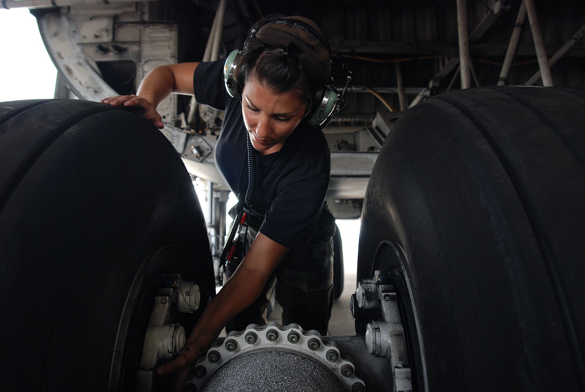 Staff Sgt. Mikela Kleinhans, a Reservist from the 433rd Airlift Wing's Aircraft Maintenance Squadron, goes through routine checks and inspections in a C-5A Galaxy cargo aircraft at Lackland AFB. Sergeant Kleinhans' job as a crew chief for a C-5 takes her all over the world with the crew of the aircraft. (U.S. Air Force photo/Airman Brian McGloin)