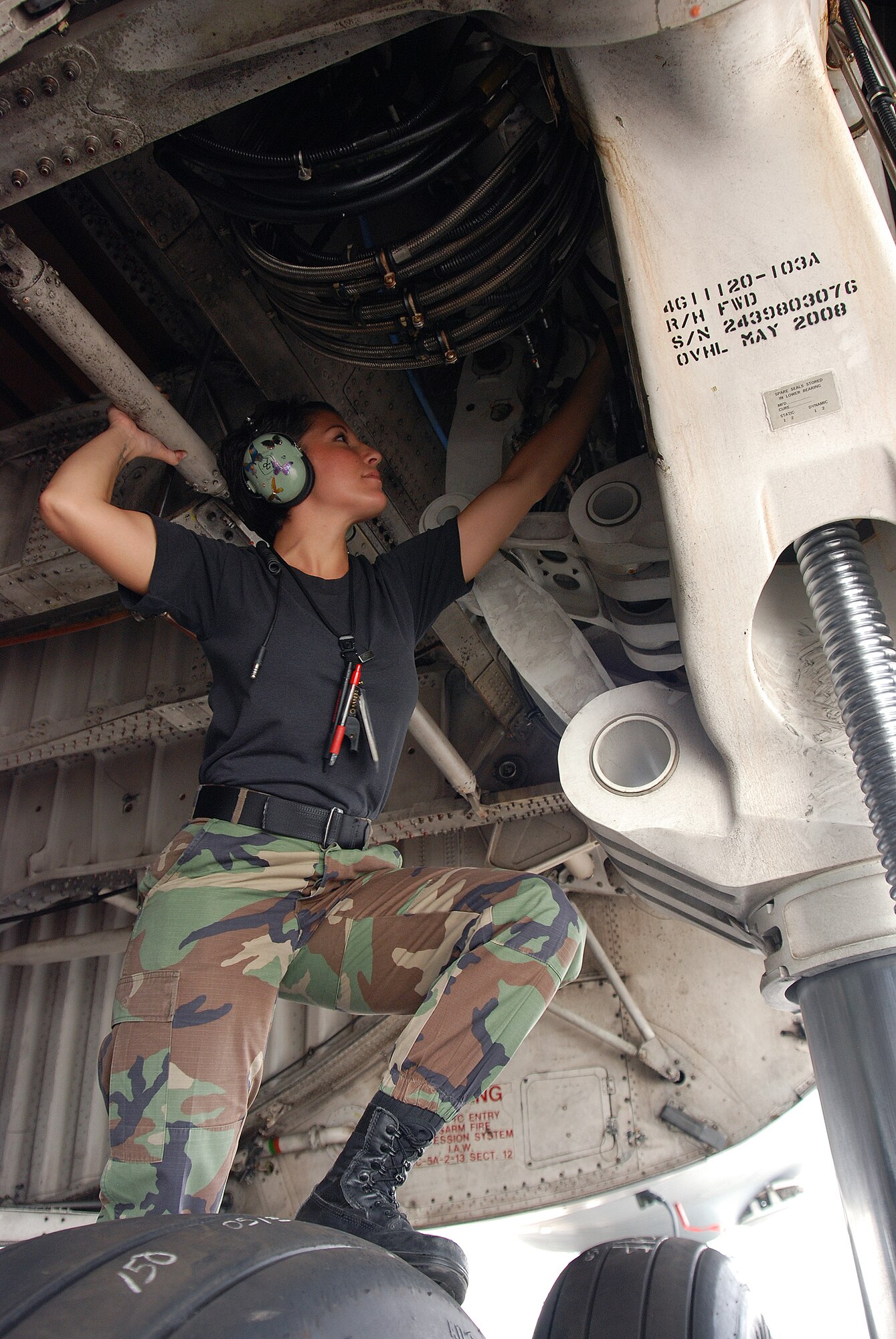 Staff Sgt. Mikela Kleinhans, a Reservist from the 433rd Airlift Wing's Aircraft Maintenance Squadron, goes through routine checks and inspections in a C-5A Galaxy cargo aircraft at Lackland AFB. Sergeant Kleinhans' job as a crew chief for a C-5 takes her all over the world with the crew of the aircraft. (U.S. Air Force photo/Airman Brian McGloin)
