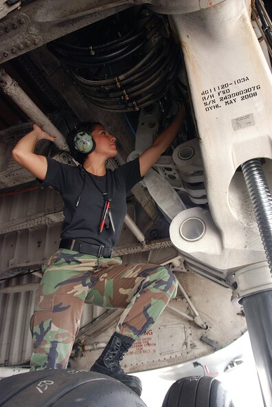 Staff Sgt. Mikela Kleinhans, a Reservist from the 433rd Airlift Wing's Aircraft Maintenance Squadron, goes through routine checks and inspections in a C-5A Galaxy cargo aircraft at Lackland AFB. Sergeant Kleinhans' job as a crew chief for a C-5 takes her all over the world with the crew of the aircraft. (U.S. Air Force photo/Airman Brian McGloin)