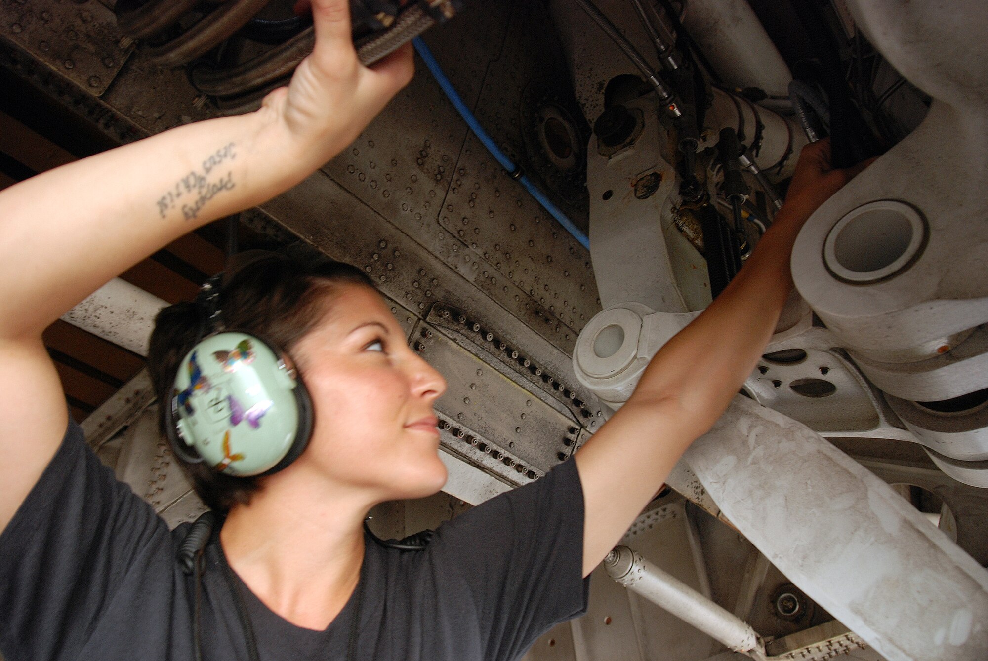 Staff Sgt. Mikela Kleinhans, a Reservist from the 433rd Airlift Wing's Aircraft Maintenance Squadron, goes through routine checks and inspections in a C-5A Galaxy cargo aircraft at Lackland AFB. Sergeant Kleinhans' job as a crew chief for a C-5 takes her all over the world with the crew of the aircraft. (U.S. Air Force photo/Airman Brian McGloin)
