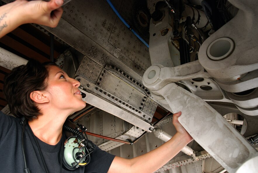 Staff Sgt. Mikela Kleinhans, a Reservist from the 433rd Airlift Wing's Aircraft Maintenance Squadron, goes through routine checks and inspections in a C-5A Galaxy cargo aircraft at Lackland AFB. Sergeant Kleinhans' job as a crew chief for a C-5 takes her all over the world with the crew of the aircraft. (U.S. Air Force photo/Airman Brian McGloin)