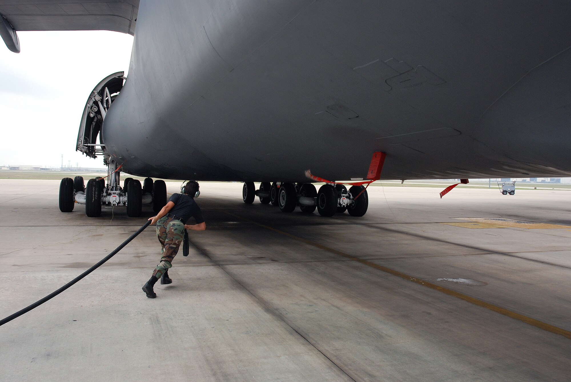 Staff Sgt. Mikela Kleinhans, a Reservist from the 433rd Airlift Wing's Aircraft Maintenance Squadron, goes through routine checks and inspections in a C-5A Galaxy cargo aircraft at Lackland AFB. Sergeant Kleinhans' job as a crew chief for a C-5 takes her all over the world with the aircraft. (U.S. Air Force photo/Airman Brian McGloin)