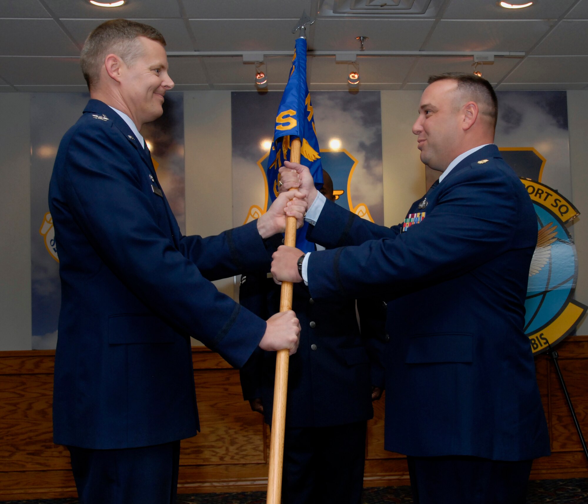 Maj. Robert Hoskins, right, accepts command of the newly-formed 82nd Force Support Squadron May 27 during an assumption of command ceremony at the Sheppard Club. The 82nd Mission Support Squadron and 82nd Services Division merged to form the new squadron. Also pictured is Col. Richard Lipsey, 82nd Mission Support Group. (U.S. Air Force photo/Mike Litteken)