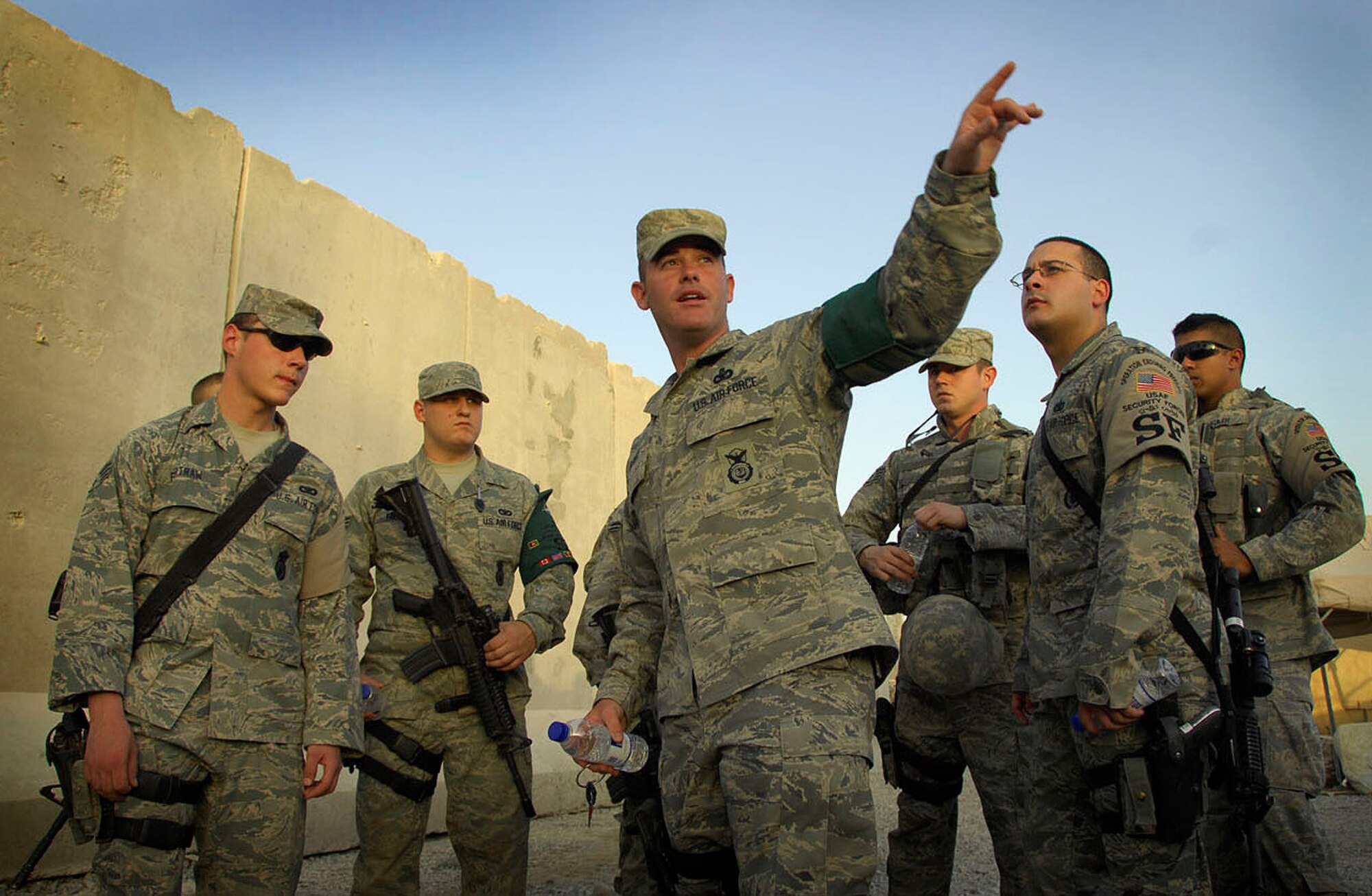 KANDAHAR AIR FIELD, Afghanistan -- Master Sgt. Joseph Ilsely, 451st Air Expeditionary Group security forces superintendent directs one of his security teams on the procedures for implementing tighter security measures around their camp perimeter May 17. (U.S. Air Force photo by 1st Lt. Noelle Caldwell)