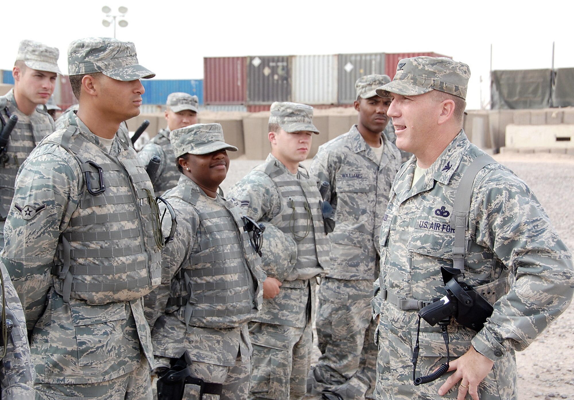 Col. Alan Metzler addresses members of the 887th Expeditionary Security Forces Squadron during their morning guardmount May 12 at Camp Bucca, Iraq. Colonel Metzler is the 586th Air Expeditionary Group commander and leads one of three groups in the Air Force dedicated to joint expeditionary taskings in the area of responsibility. (U.S. Air Force photo/Staff Sgt. Thomas J. Doscher) 
