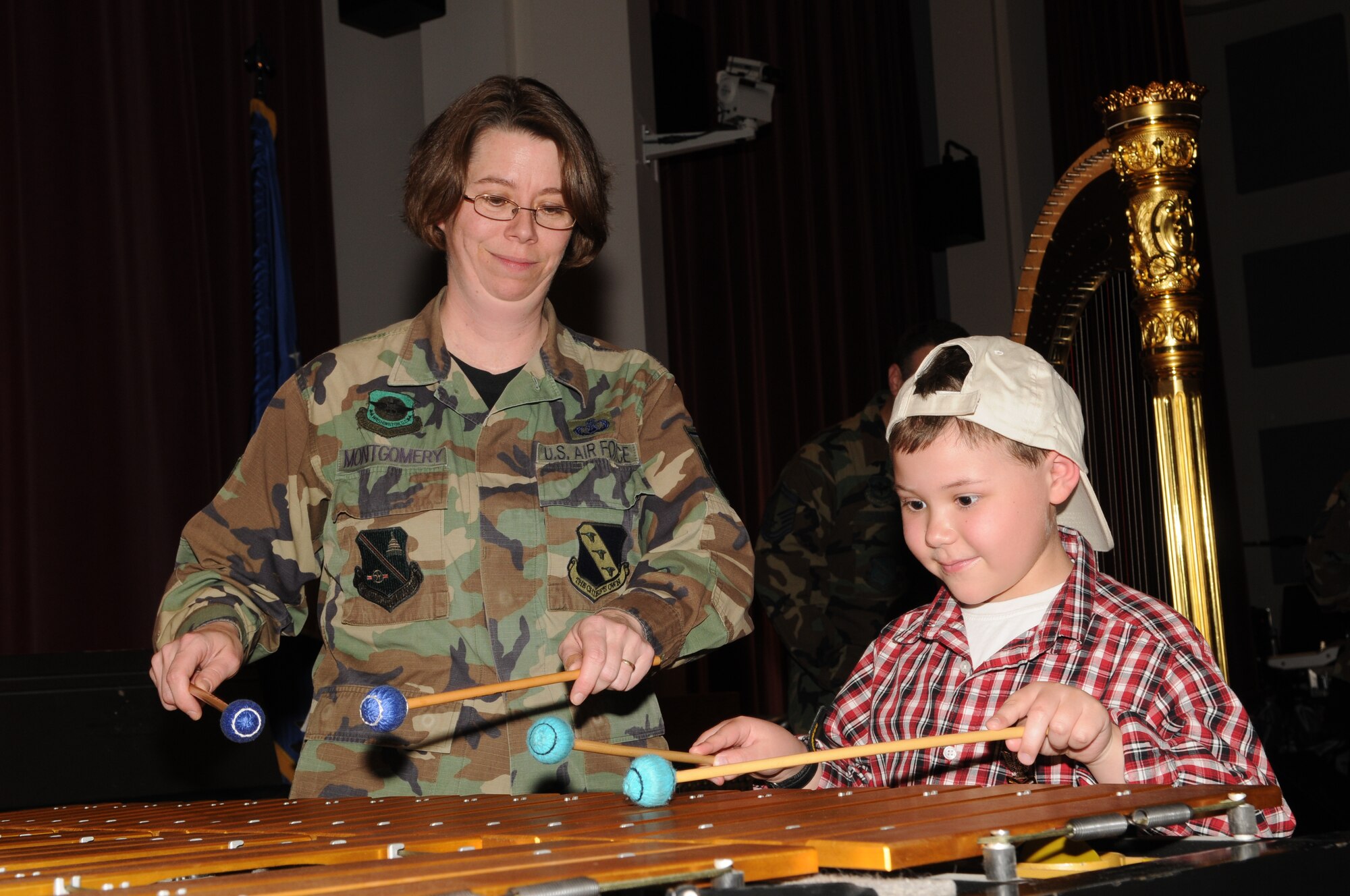 Master Sgt. Erica Montgomery demonstrates the marimba during a
visit from children of the Make-A-Wish Foundation on March 20. The
day consisted of performances, demonstrations and a luncheon. The
children received a tour of Bolling Air Force Base, culminating with a
visit to The USAF Band. Since 1980, the Make-A-Wish Foundation has
given hope, strength and joy to children with life-threatening medical
conditions. (U.S. Air Force photo by Senior Airman Sean Adams)