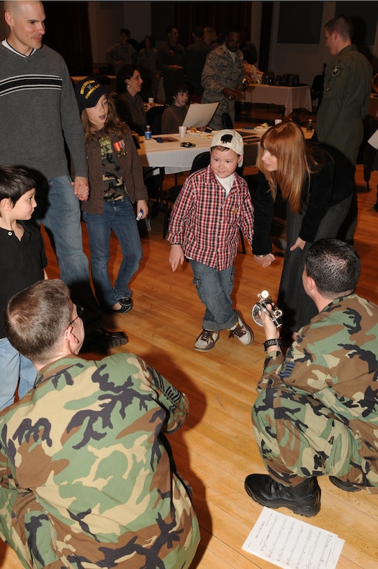 Senior Master Sgt. Andy Wilson and Technical Sgt. Christian
Pagnard answer questions after a performance for chidren from the
Make-A-Wish Foundation. Since 1980, the Make-A-Wish Foundation® has
enriched the lives of children with life-threatening medical
conditions through its wish-granting work. (U.S. Air Force photo by Senior Airman Sean Adams)