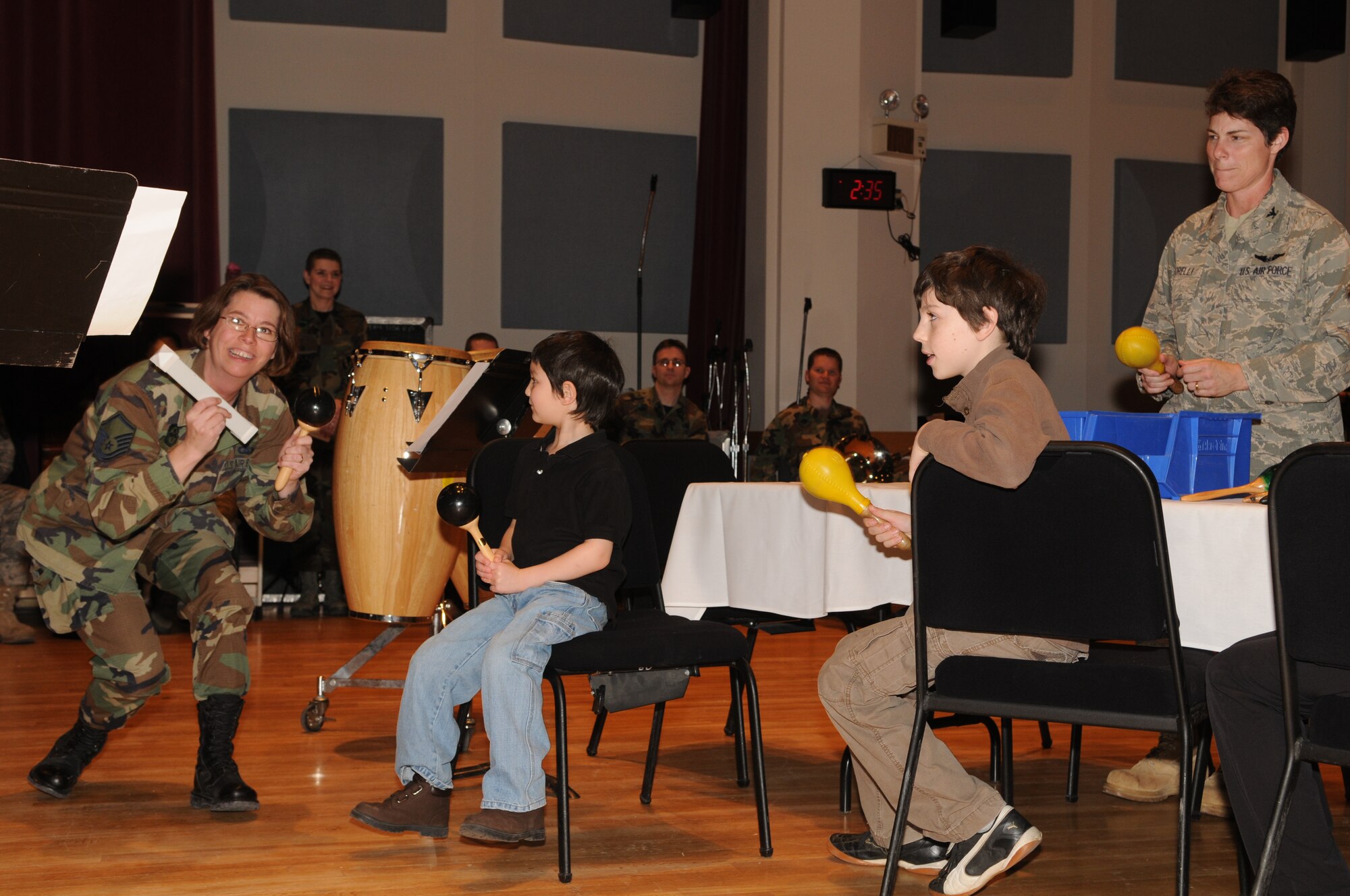 Master Sgt. Erica Montgomery and Operations Group Commander
Colonel Elizabeth Borelli demonstrate percussion instruments to
children from the Make-A-Wish Foundation on March 20. The Make-A-Wish
Foundation has been granting wishes to children with progressive,
degenerative or malignant conditions since 1980 and has reached more
than 167,000 children around the world. (U.S. Air Force photo by Senior Airman Sean Adams)