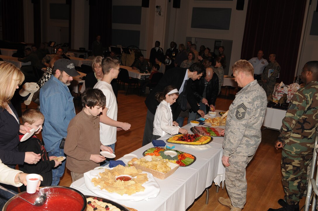 Children from the Make-A-Wish Foundation enjoy lunch following
a performance and demonstration by units of the USAF Band. The
children visited Bolling Air Force Base on March 20. The Foundation's
mission reflects the life-changing impact that a Make-A-Wish
experience has on children, families, referral sources, donors,
sponsors, and entire communities. (U.S. Air Force photo by Senior Airman Sean Adams)