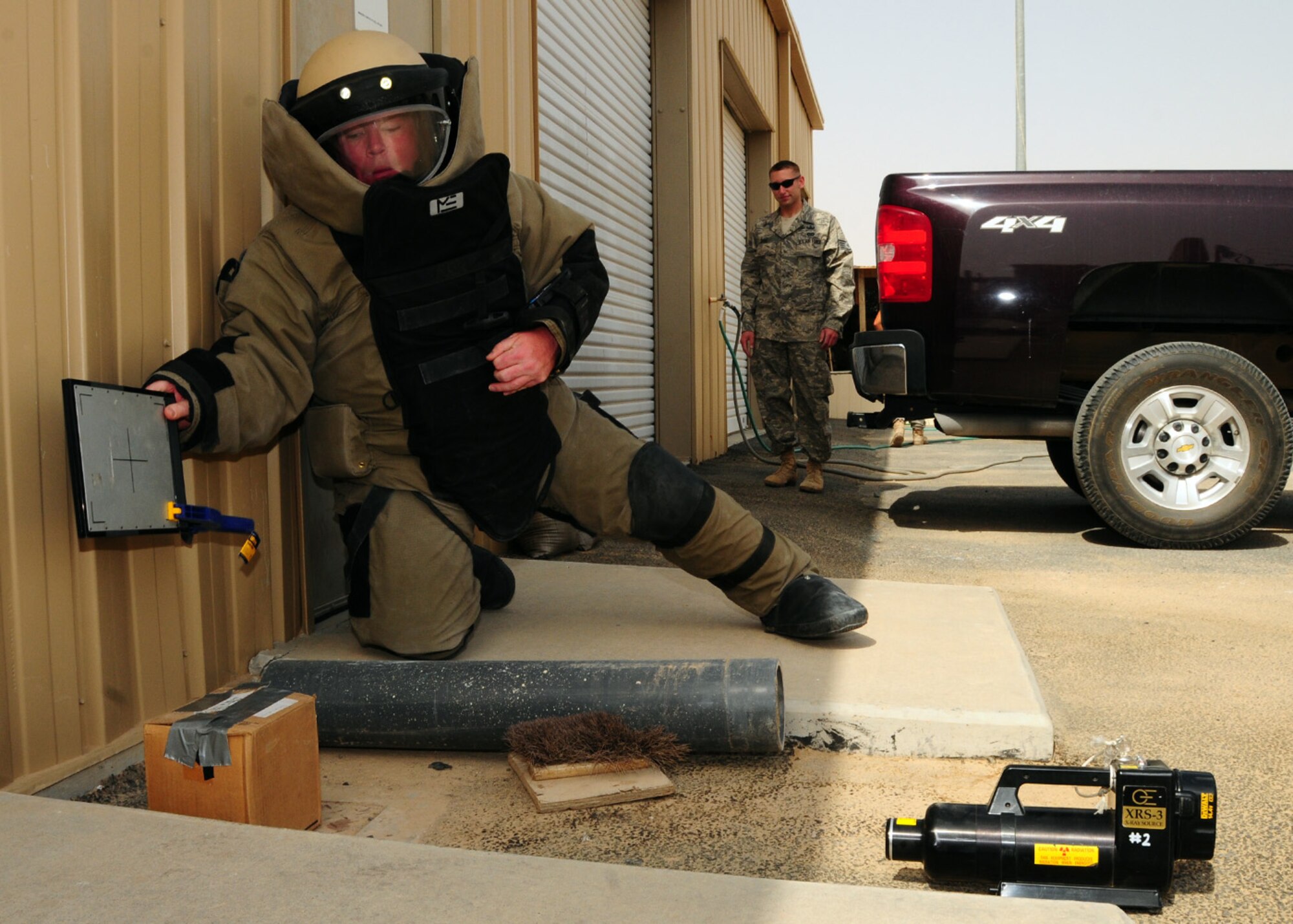 SOUTHWEST ASIA -- Tech. Sgt. Michael O'Toole, 386th Expeditionary Civil Engineer Squadron explosive ordnance disposal, emplaces an XRS-3 x-ray apparatus to examine a simulated suspicious package during training at an air base in Southwest Asia, May 27. The x-ray apparatus allows the explosive ordnance disposal personnel to determine what is in the suspicious package and the appropriate actions that need to be taken. Sergeant O'Toole is deployed from Luke Air Force Base, Ariz., and is originally from East Durham, N.Y. (U.S. Air Force photo/ Senior Airman Courtney Richardson)