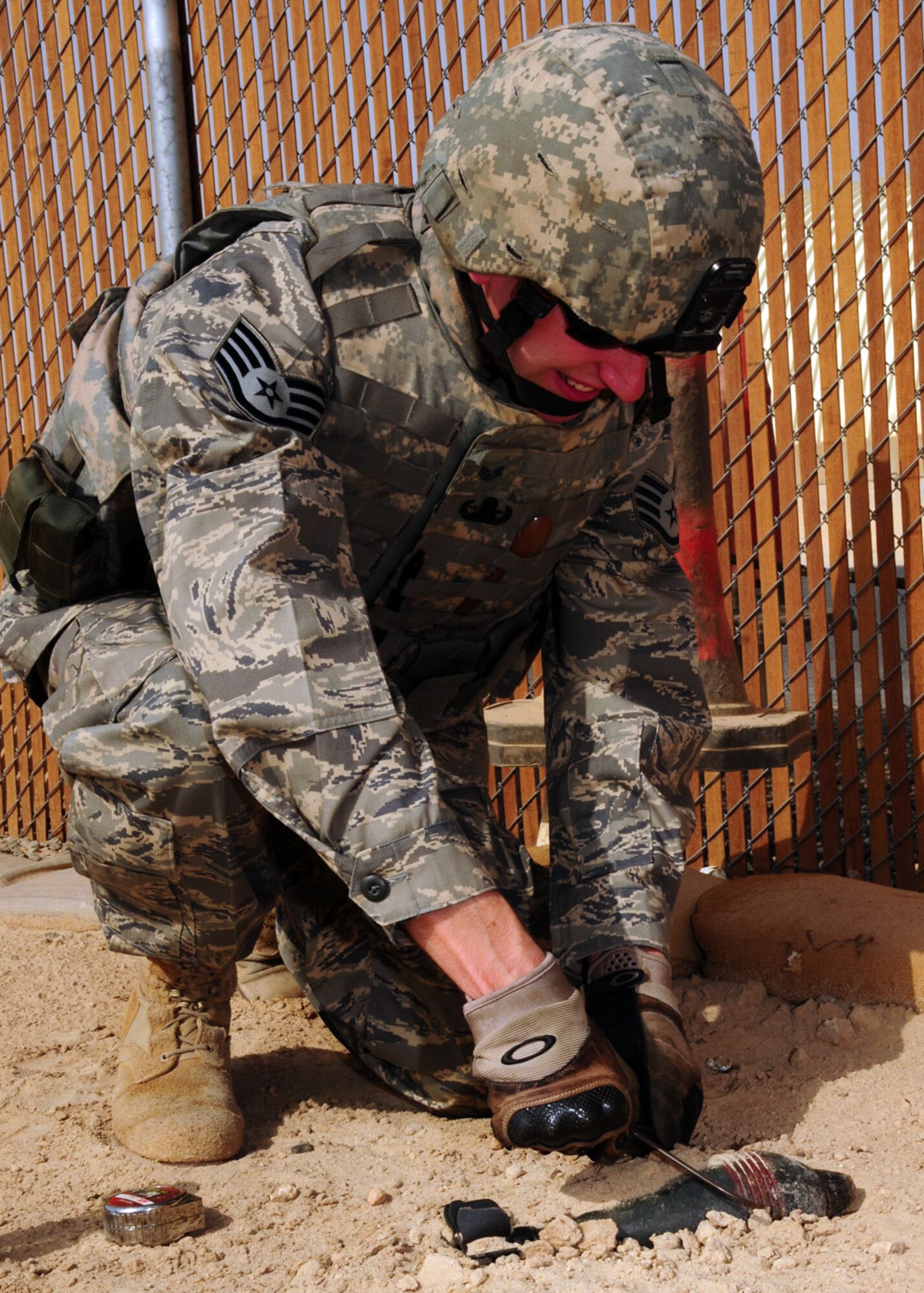 SOUTHWEST ASIA -- Staff Sgt. Brian Dube, 386th Expeditionary Civil Engineer Squadron explosive ordnance disposal, uses a caliper to measure the diameter of a simulated unexploded ordnance for positive identification purposes during training at an air base in Southwest Asia, May 27. Once the UXO is measured, the caliper is then removed and the distance is read by measuring between the tips with a measuring tool, such as a ruler. Sergeant Dube is deployed from Nellis Air Force Base, Nev., and is originally from Torrington, Conn. (U.S. Air Force photo/ Senior Airman Courtney Richardson)