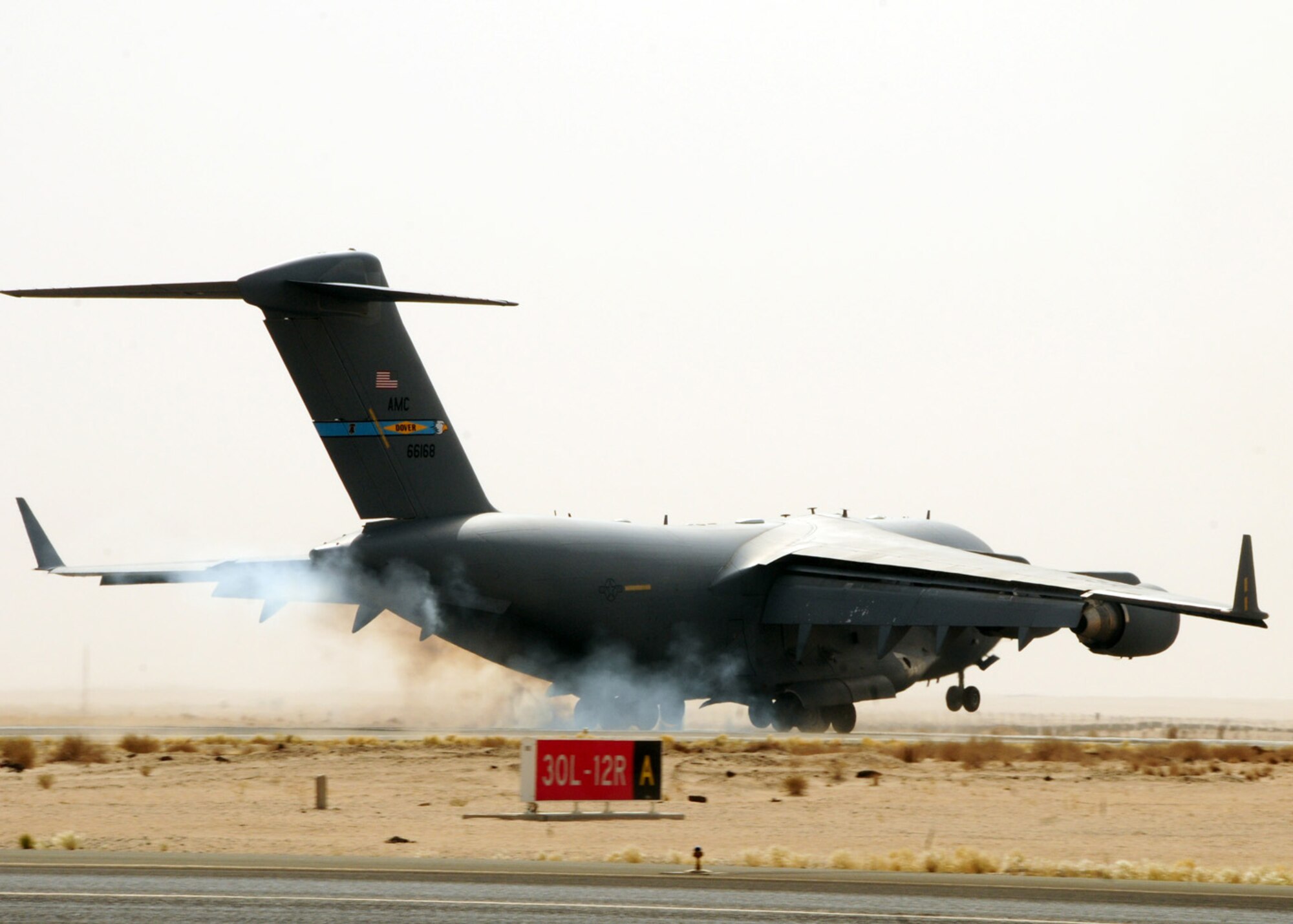 SOUTHWEST ASIA -- A C-17 Globemaster III lands at an air base in Southwest Asia, May 26. The C-17 Globemaster III is capable of carrying 102 troops/paratroops, 48 litter and 54 ambulatory patients with attendants and 170,900 pounds of cargo. (U.S. Air Force photo/ Senior Airman Courtney Richardson)